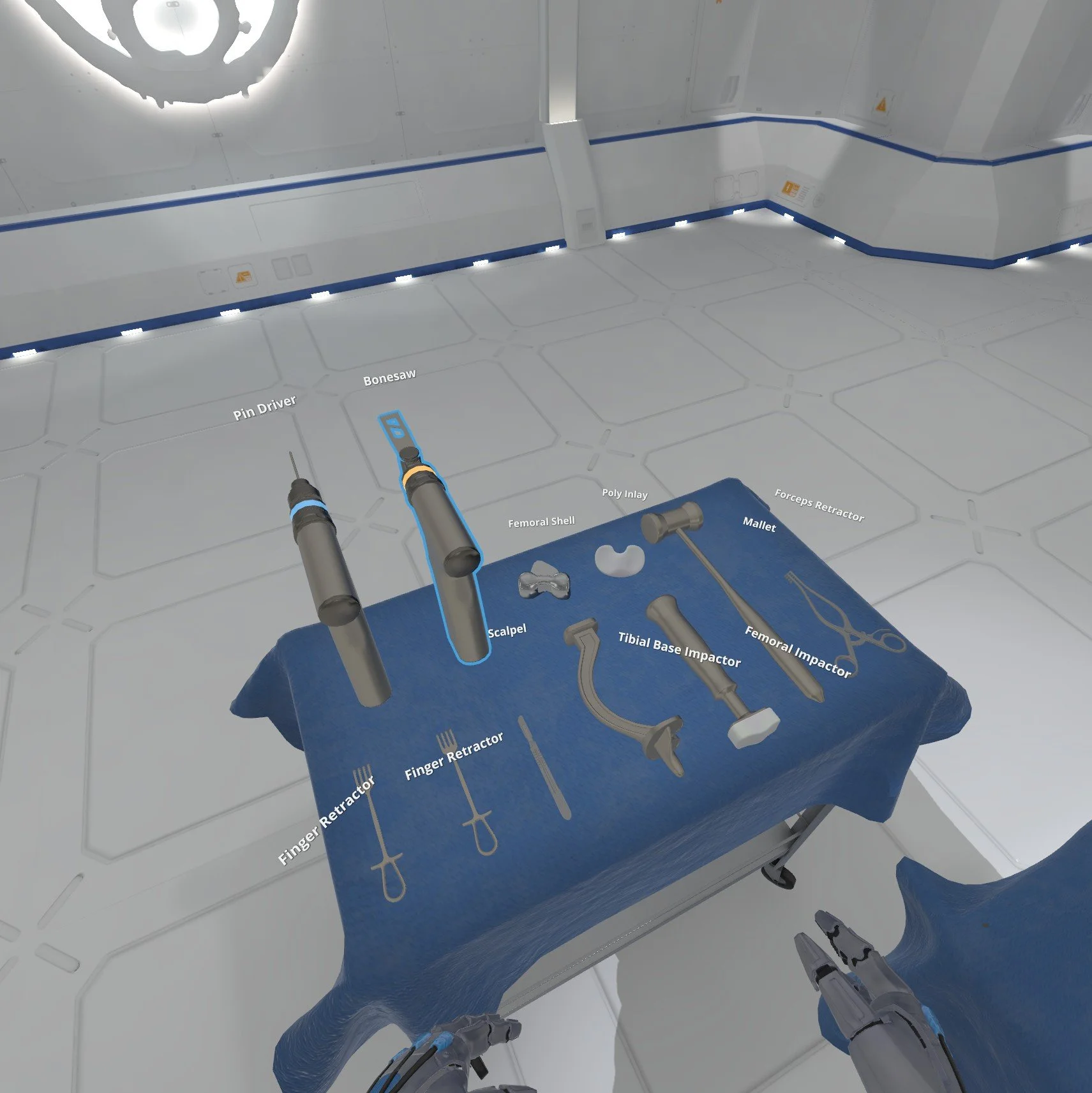 A virtual reality medical simulation showing surgical tools on a blue cloth and a pair of robotic hands in a high-tech surgical room.