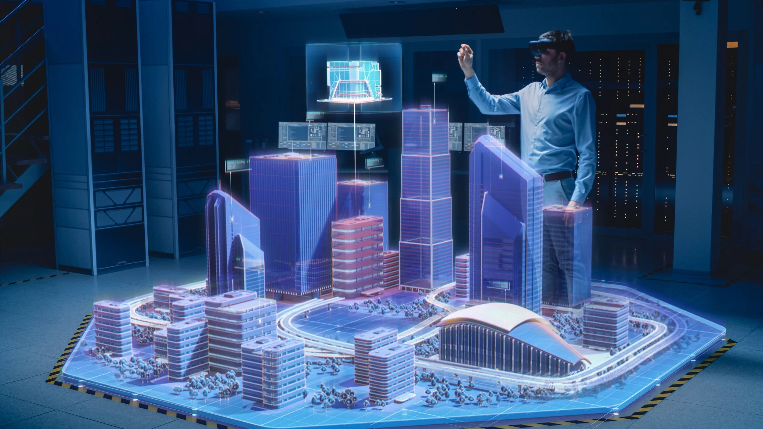 A person using augmented reality tools to view a holographic model of a modern city with tall buildings and infrastructure in a high-tech setting.
