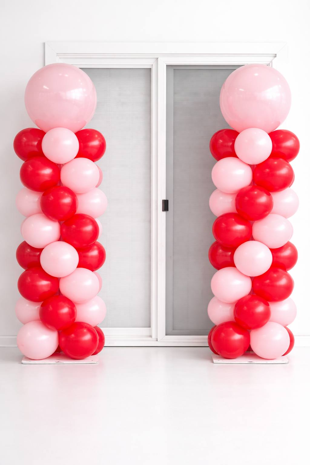Red and pink classic balloon columns, perfect for entrances and romantic themes.