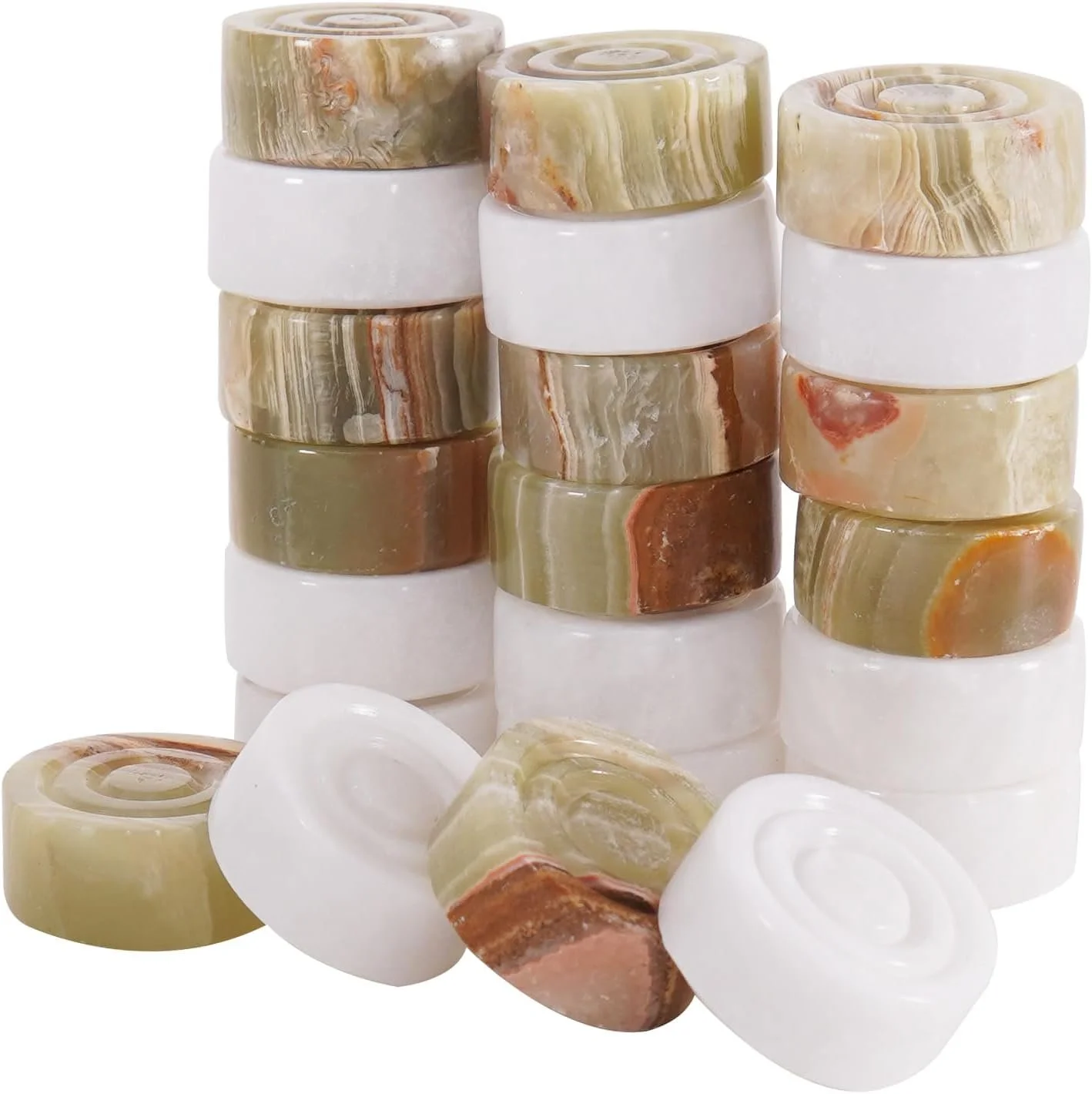 Stacked onyx playing pieces in soft green, white, and rust tones.