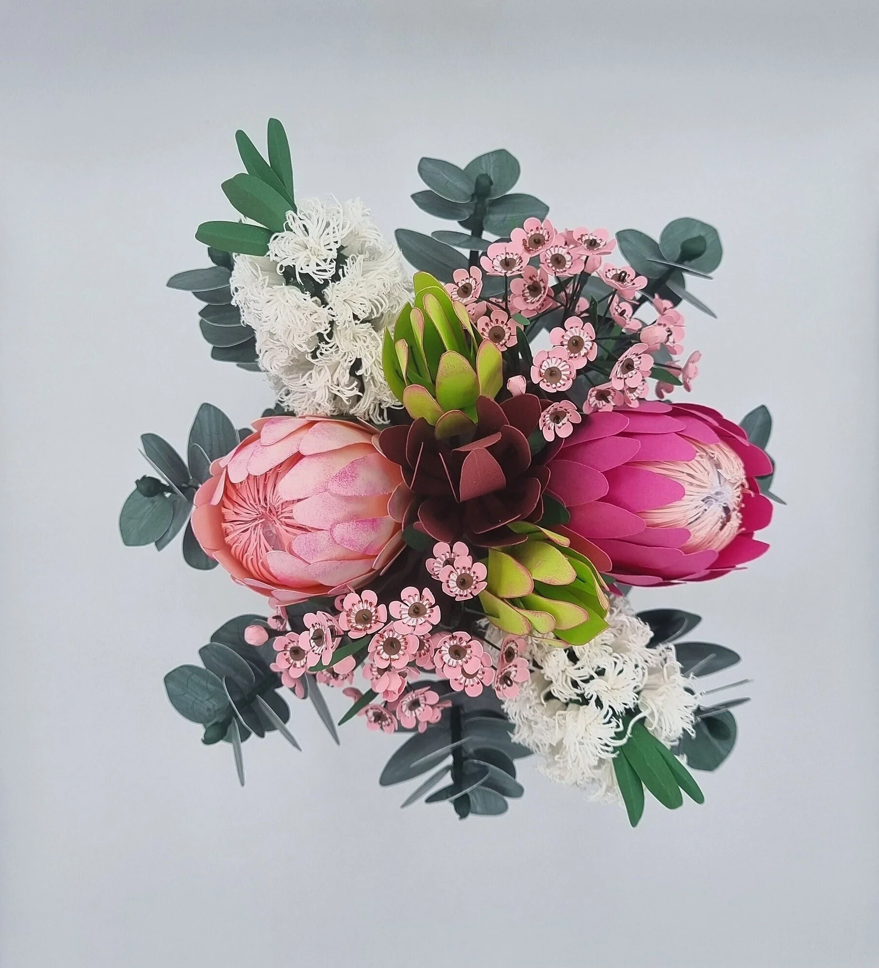 Handcrafted paper bouquet featuring Proteas, eucalyptus, and wax flowers — a lasting Australian native-inspired floral gift for any occasion.