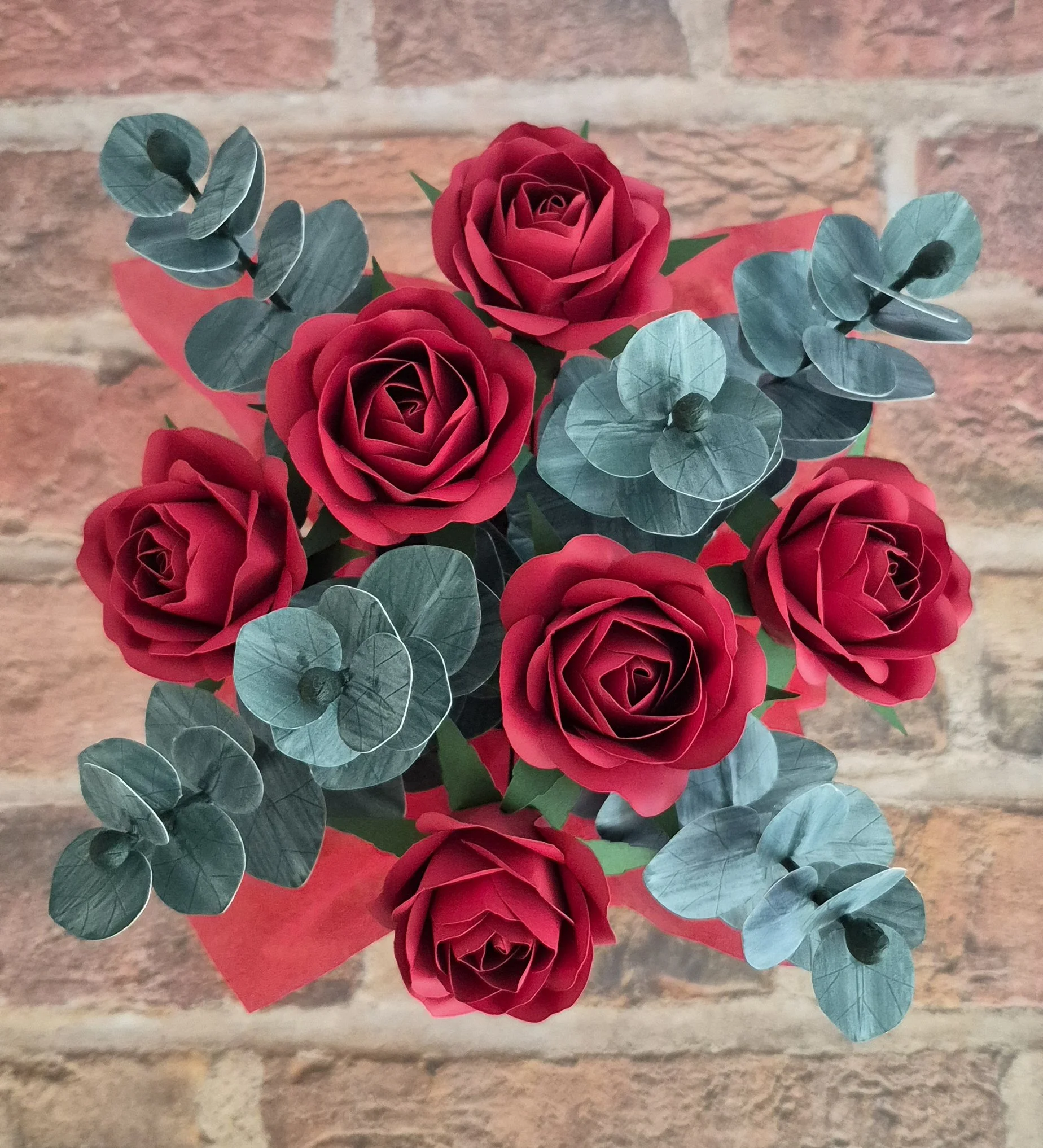 Red paper roses with eucalyptus leaves handmade floral arrangement