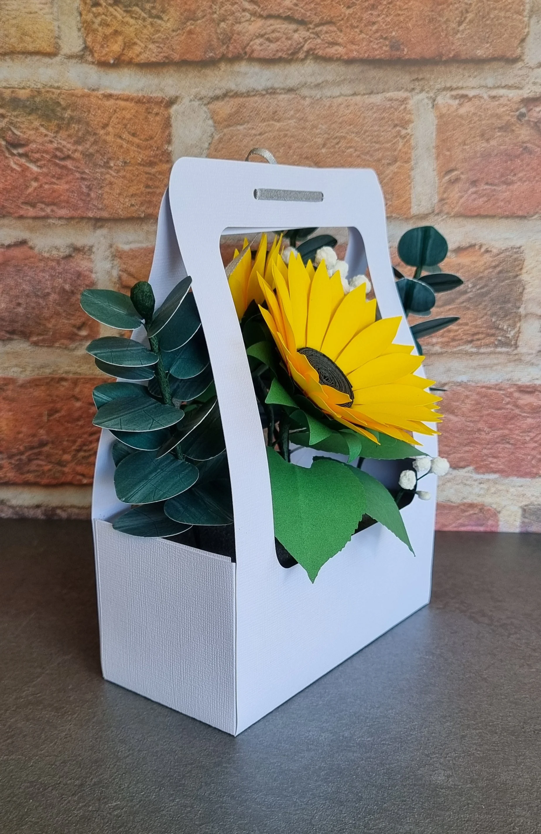 Angled side view of the sunflower paper flower gift box showing the layered petals, eucalyptus leaves, and the wooden-style thank-you plaque..jpg