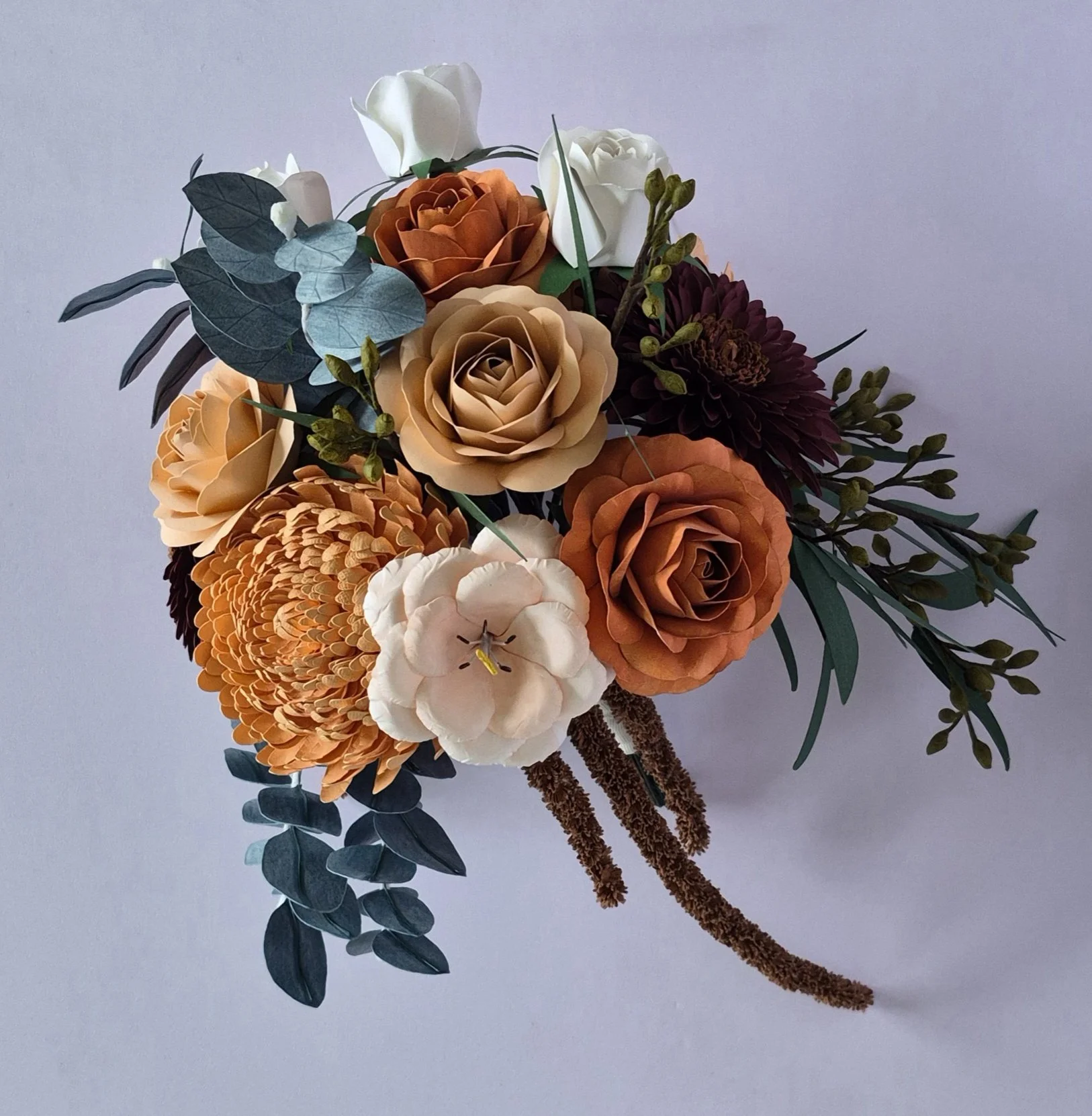 Handcrafted paper wedding bouquet replica featuring detailed florals and native-inspired elements, designed to celebrate a couple’s special day for years to come.