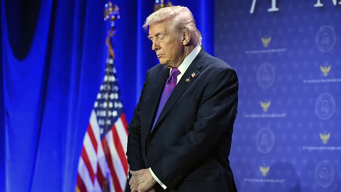 US President Donald Trump bows his head in prayer during the National Prayer Breakfast at the Washington Hilton in February 5, 2026. (Saul Loeb/AFP via Getty Images)