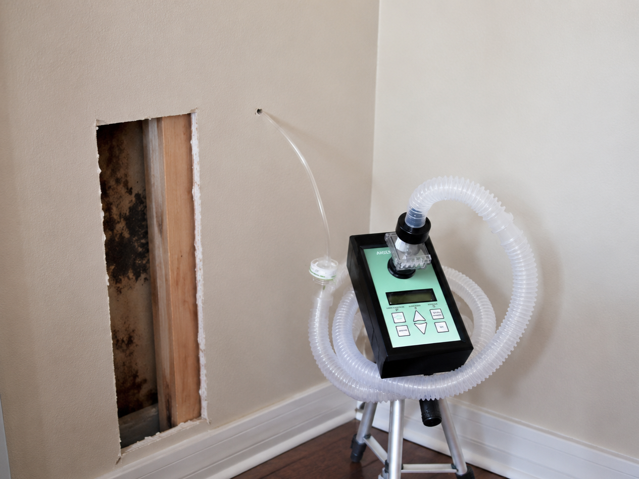 Room inspection with diagnostic equipment setup for wall cavity testing