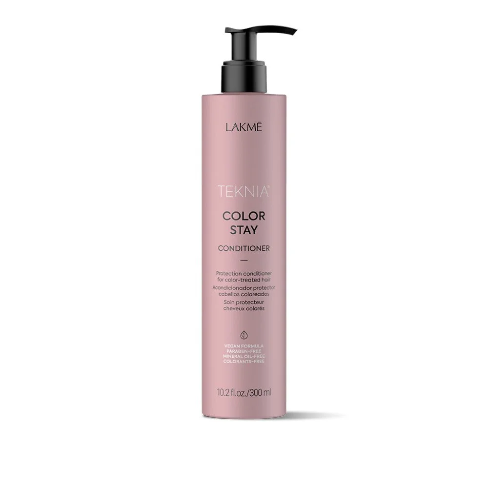 A pink bottle of Lakme Teknia Color Stay Conditioner with a black pump dispenser, designed for color-treated hair.