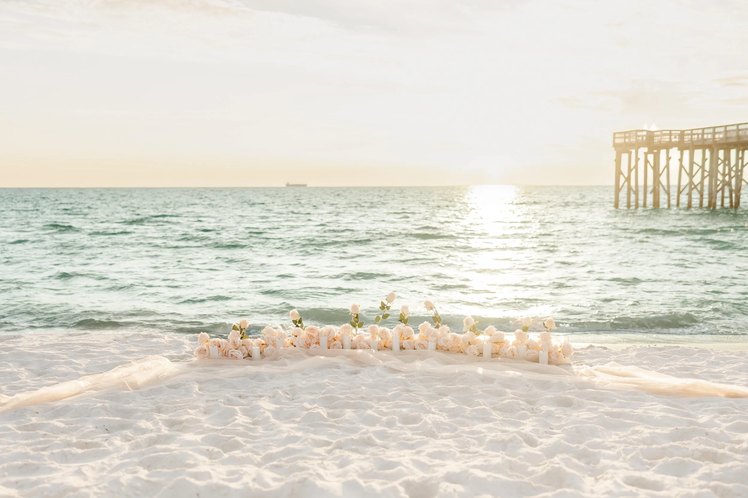 Panama City Beach Proposal with peach rose set up from coastal bloom, photos by Panama City beach photographers team