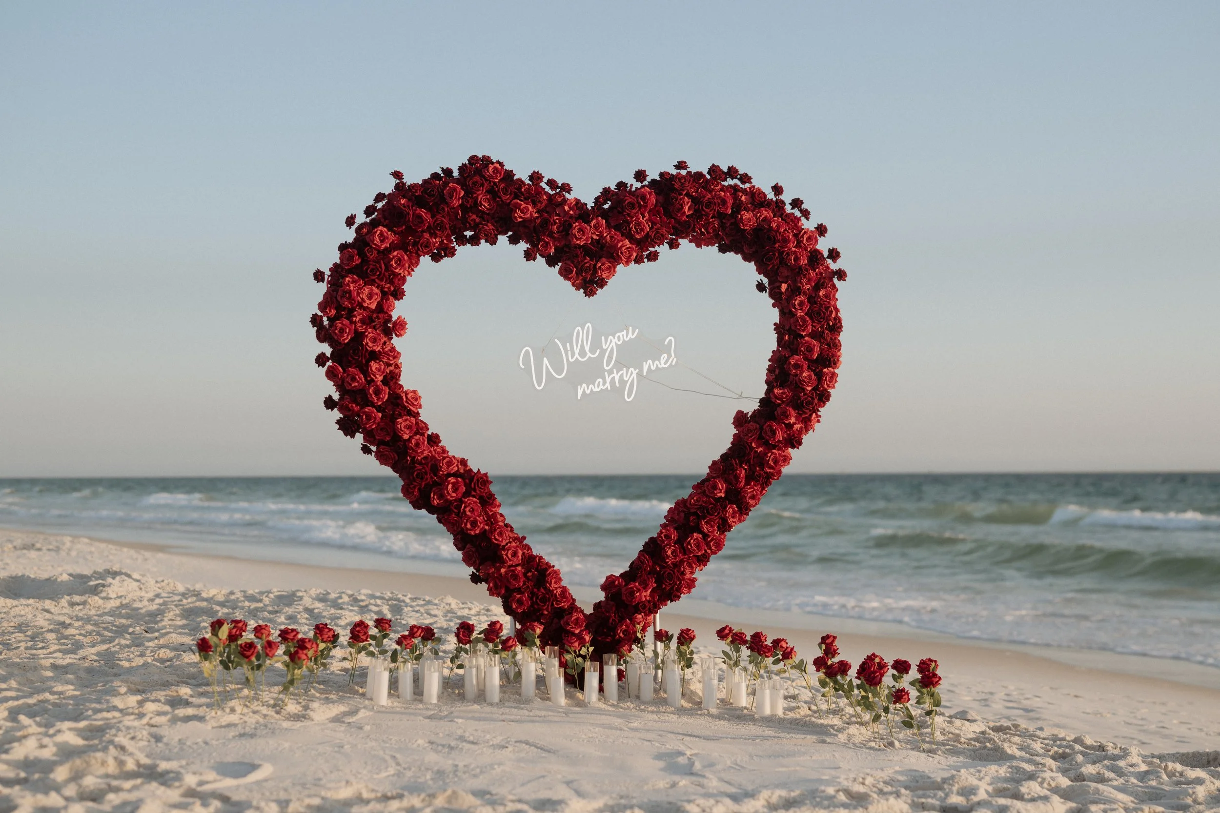 Panama City Beach Proposal with deep rose set up from coastal bloom, photos by Panama City beach photographers team