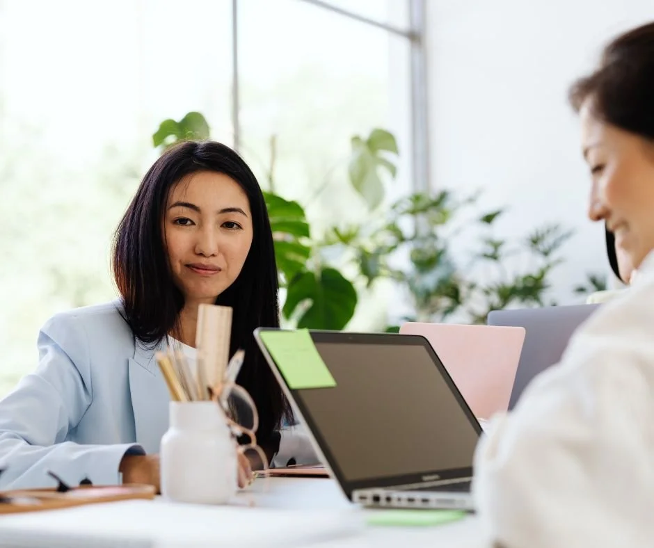 Woman in co-working space looking at camera.jpg