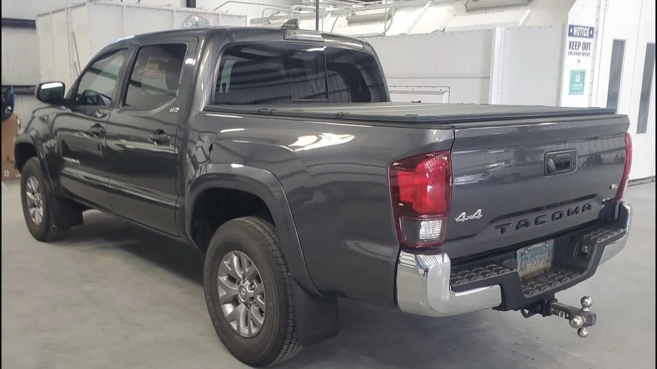 Gray Toyota Tacoma pickup truck in a garage