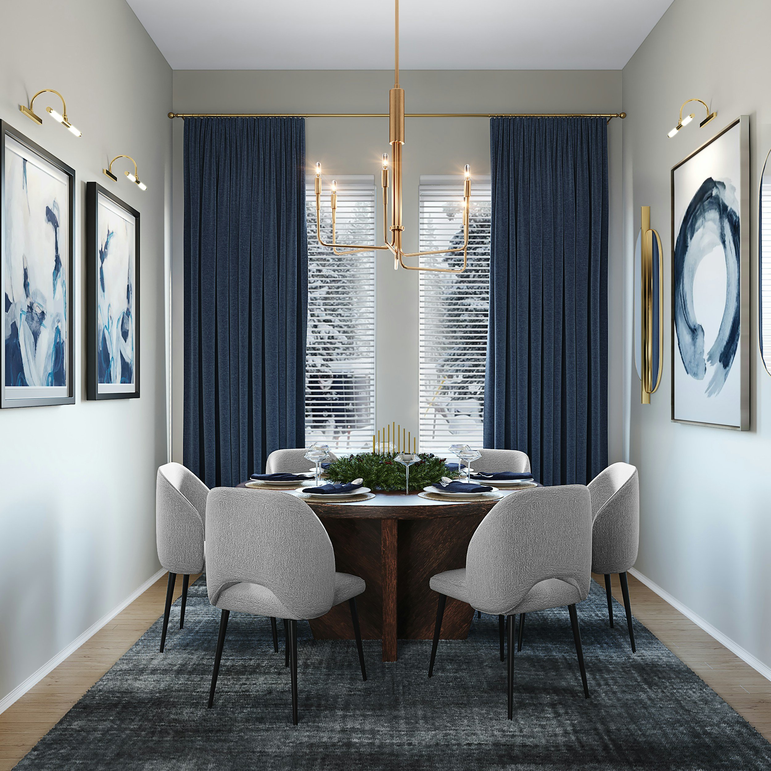 A modern dining room with a round wooden table set for six with black plates and glasses, surrounded by six light gray upholstered chairs, with dark blue curtains, abstract paintings, and a gold chandelier.