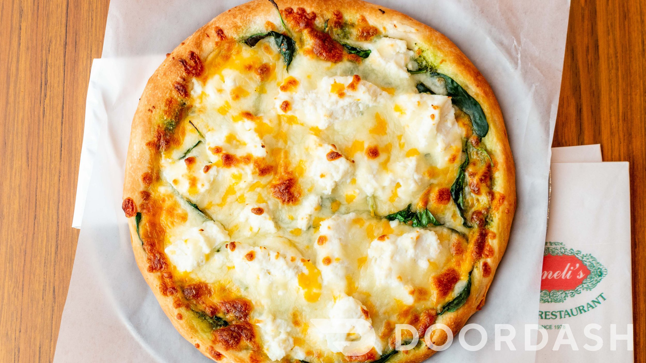 Pesto pizza with ricotta and spinach