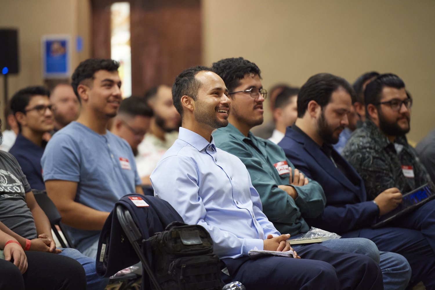 Catholic men gathered at a TUC7 community event