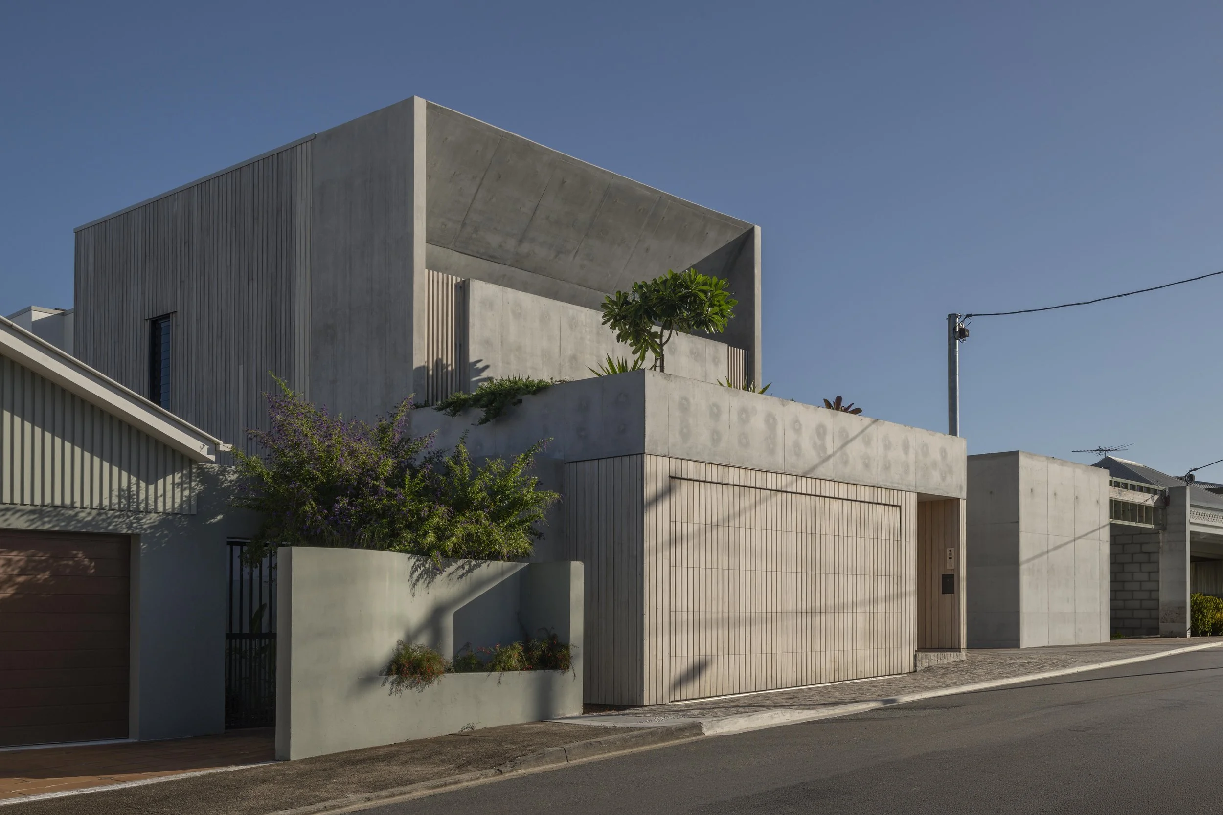 CASE STUDY: Project 124 – A Three‑Level Architectural Home on a Steep Riverfront Site