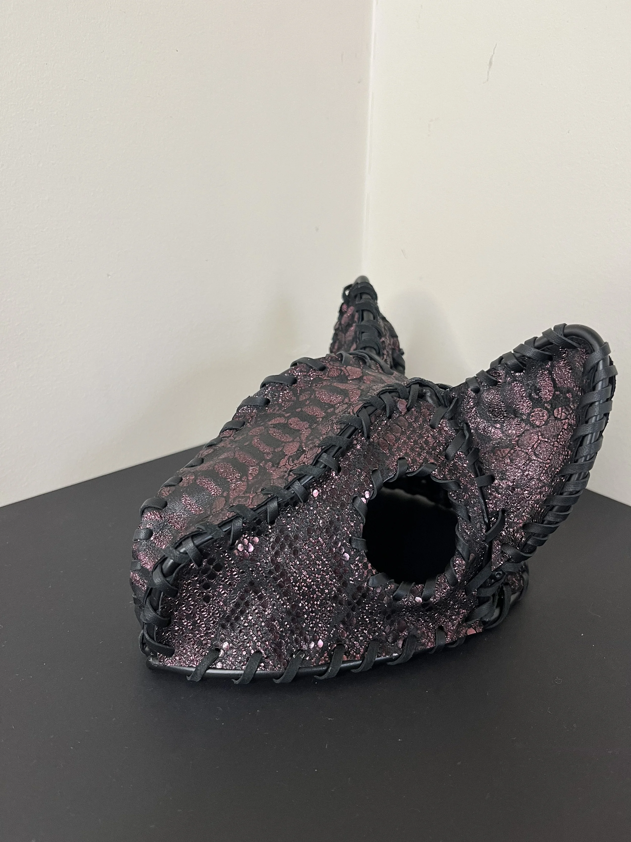 “Iolite” (2026), welded steel, paint, leather, 17(w) x 11(h) x17(d) cm