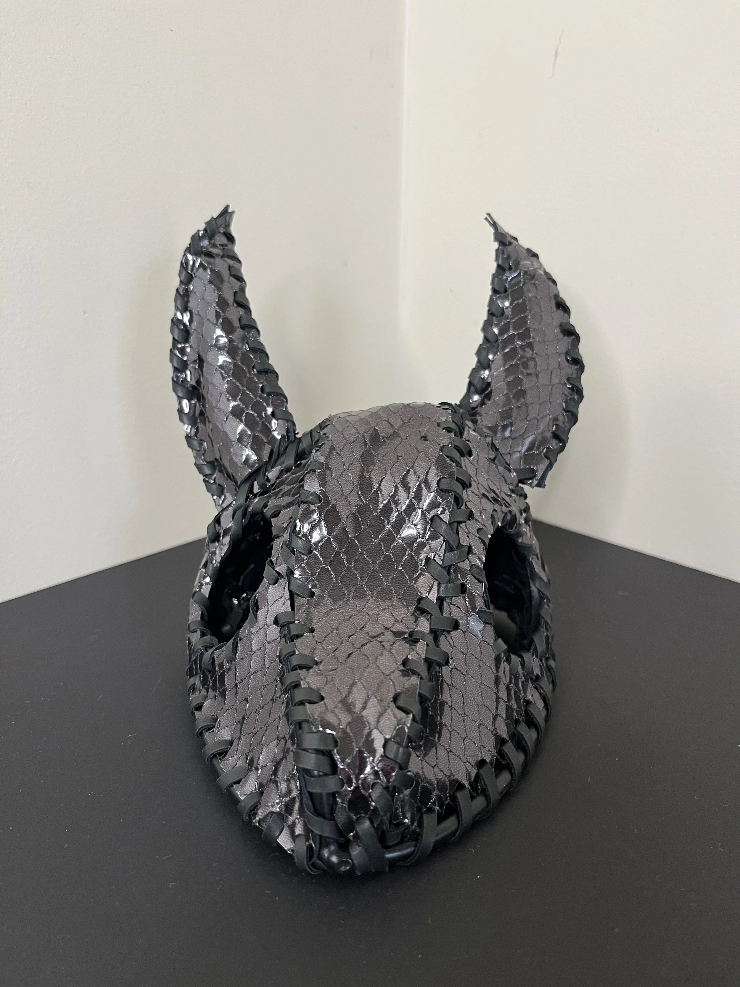 “Obsidian” (2026), welded steel, paint, leather, 14(w) x 14(h) x14(d) cm