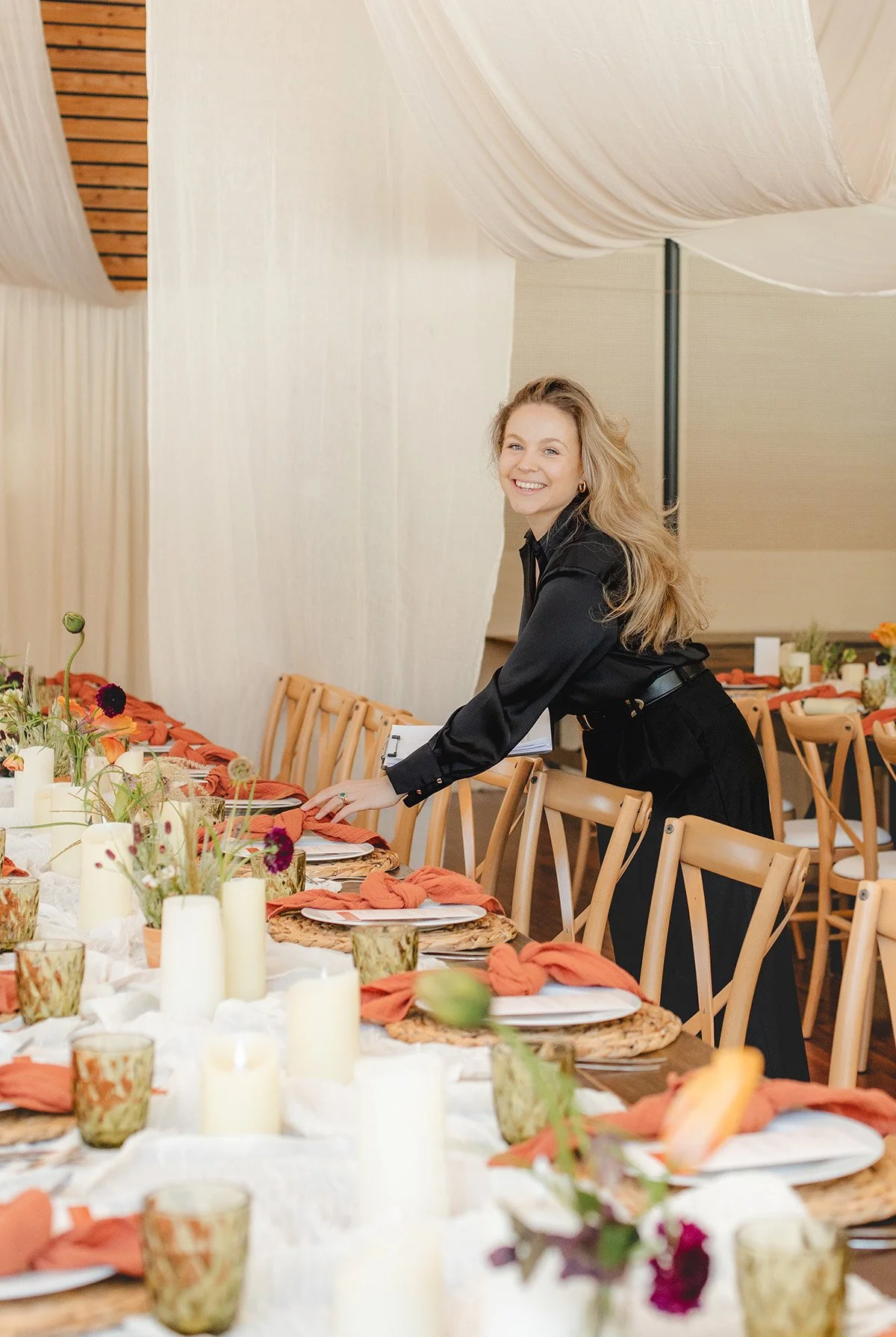 destination wedding day coordinator Francesca, organising the decor of the tables at Domaine du Baron Montriond venue double border