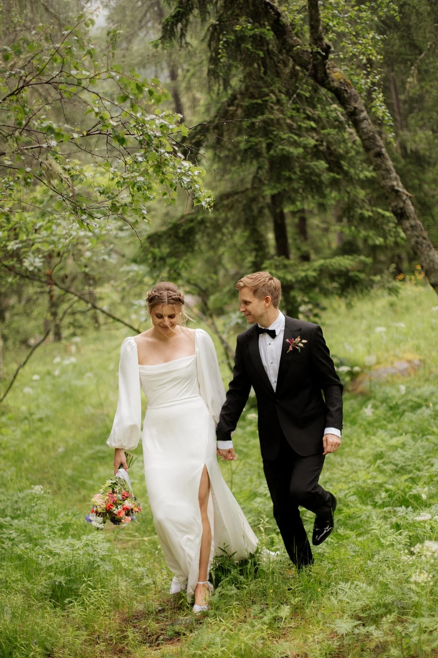 chamonix-wedding-couple-walking-alpine-field.jpg
