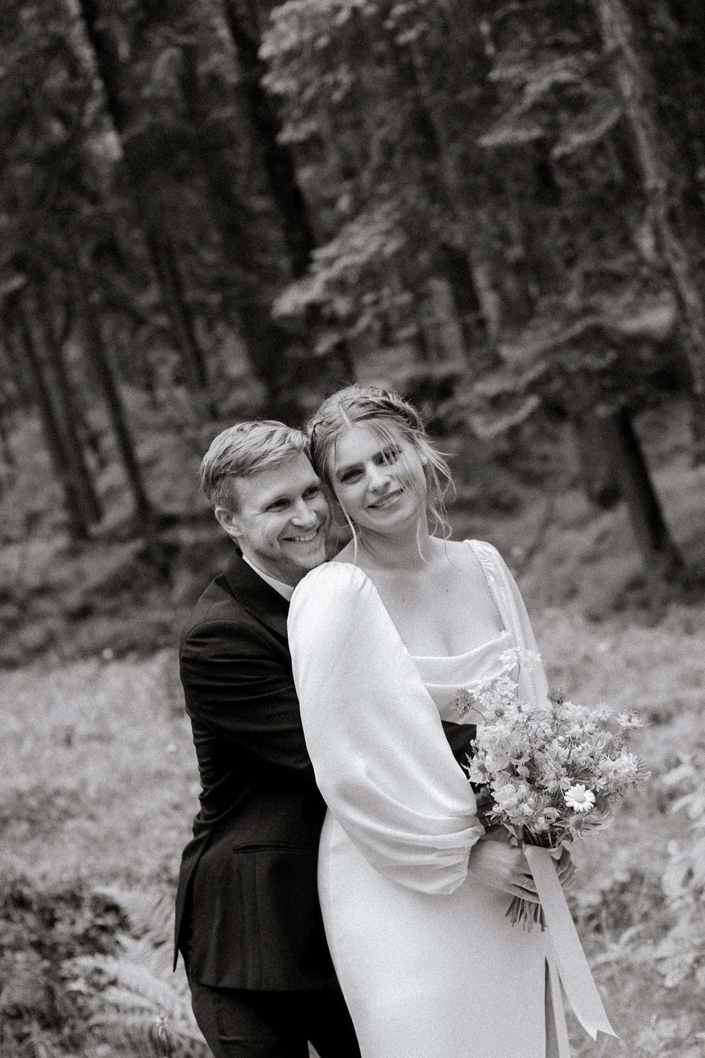 chamonix-wedding-couple-embrace-forest-black-white.jpg