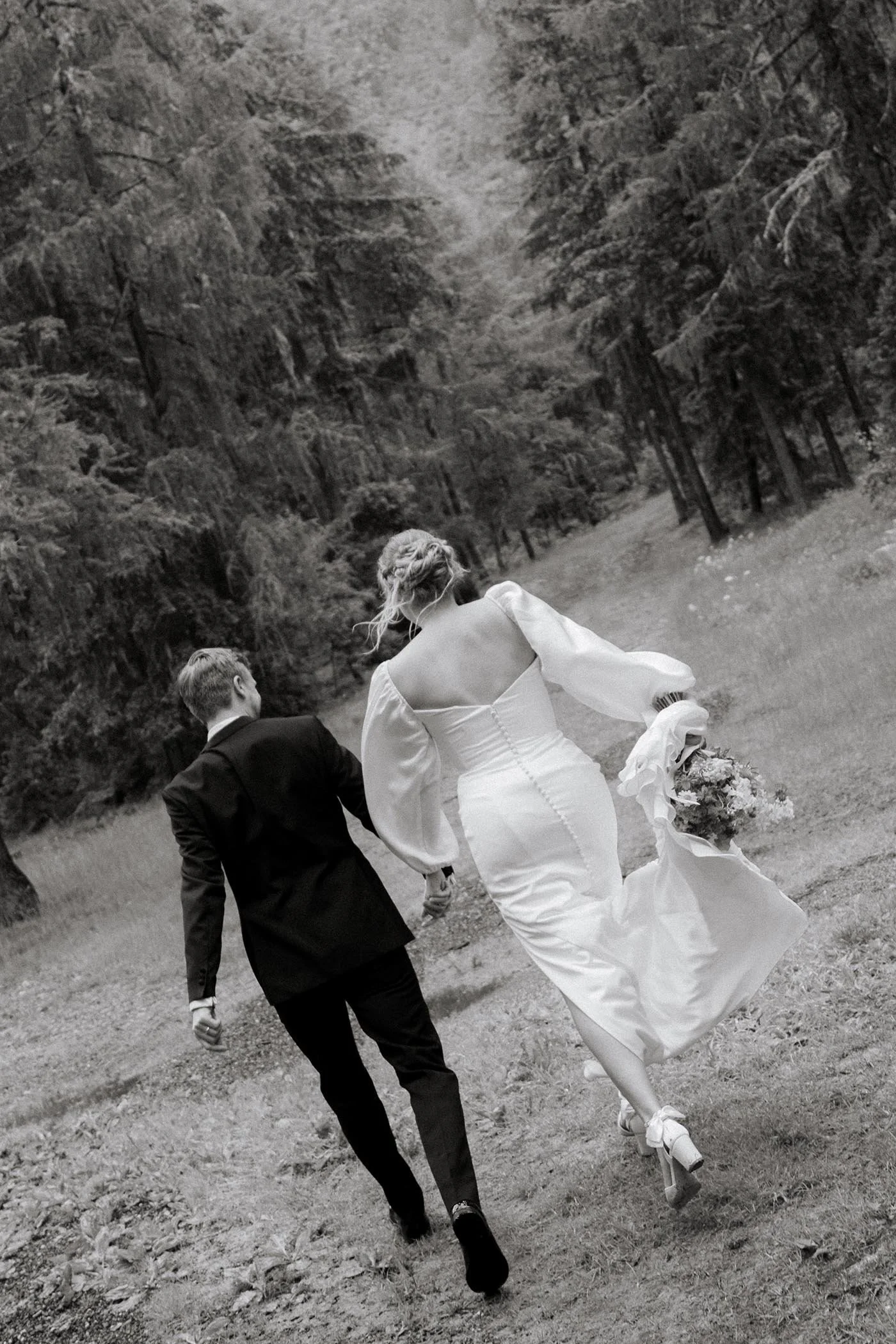 chamonix-wedding-couple-walking-forest-black-white.jpg