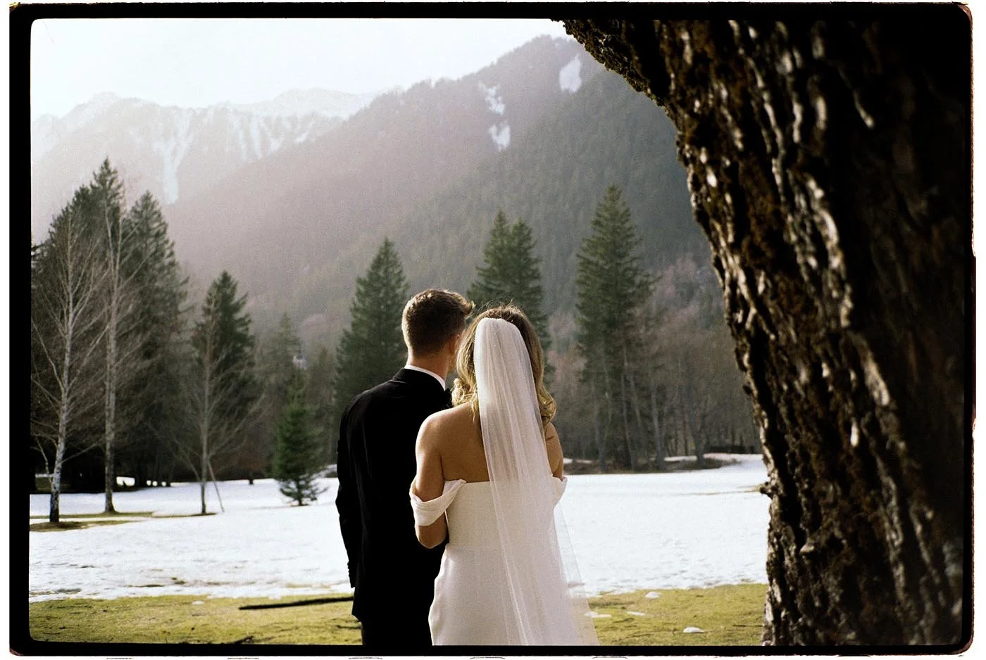 tori-harry-chamonix-wedding-couple-walking-mountains.jpg