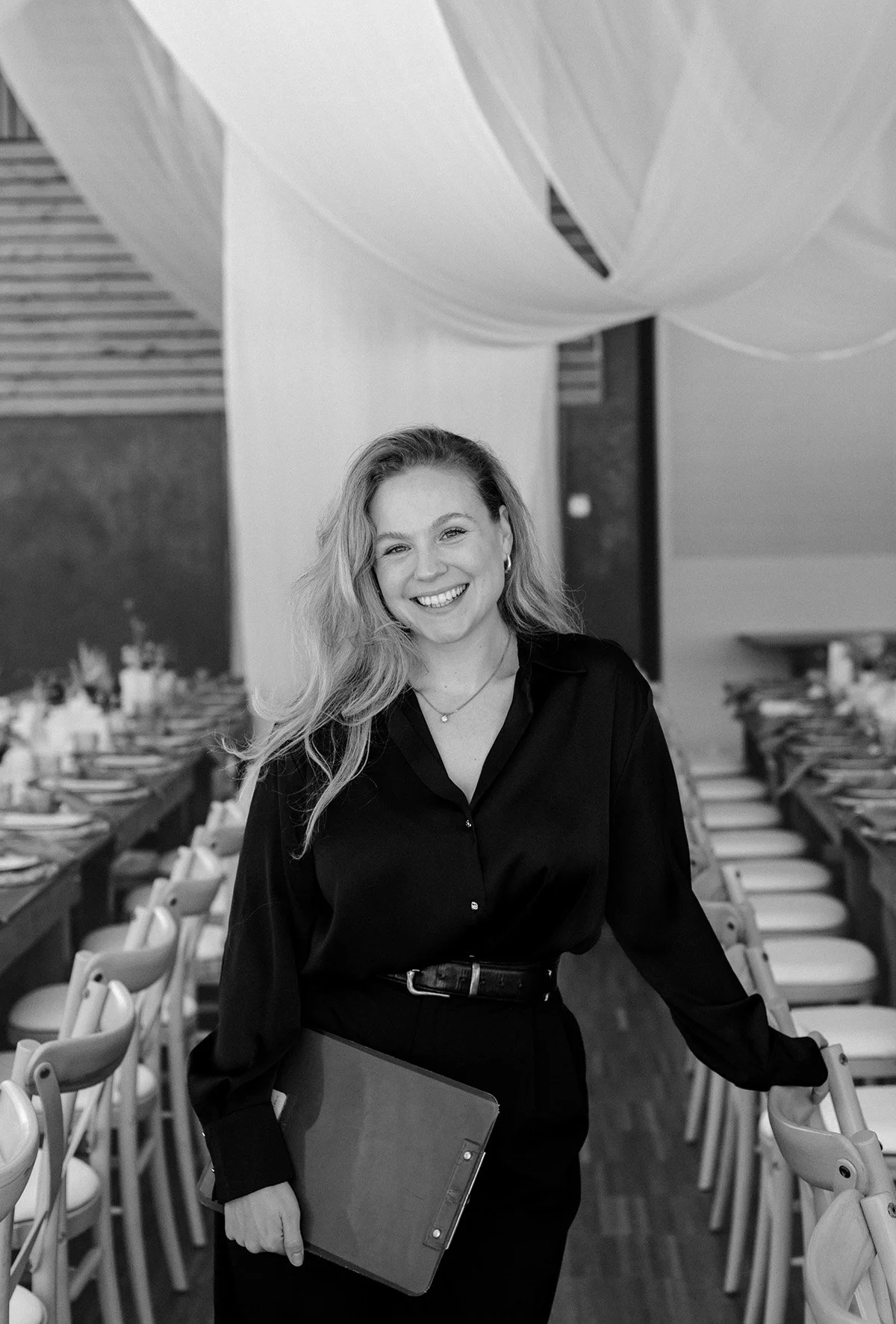 Destination wedding package wedding planner Francesca in a smart outfit, in the Domaine du Baron wedding venuedouble border