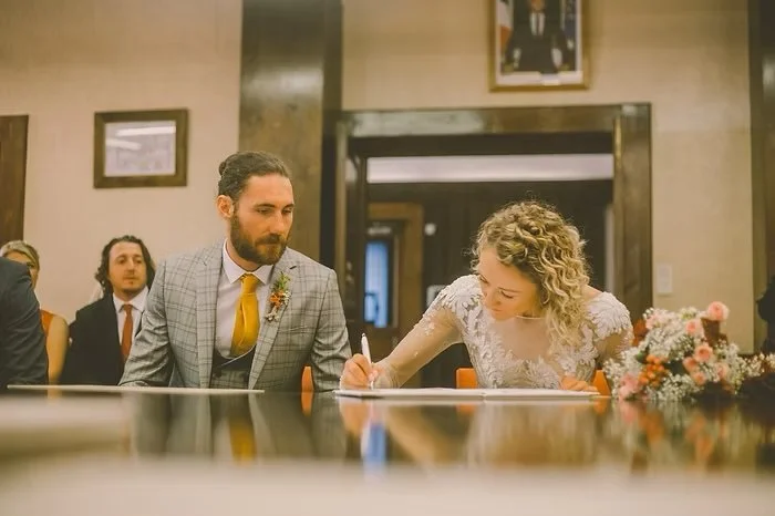 Bride & Groom signing their wedding papers in the marie of Montriond French Alps