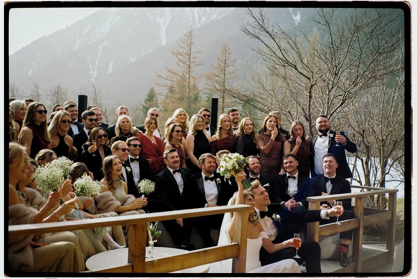 tori-harry-chamonix-wedding-group-celebration-toast.jpg