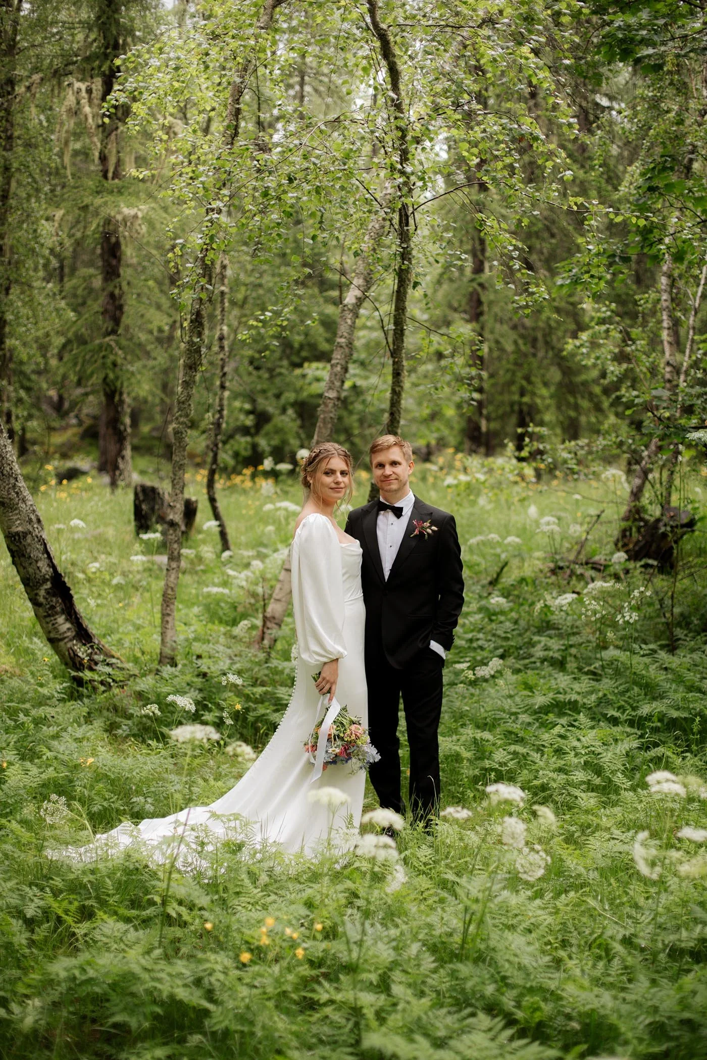 chamonix-wedding-couple-walking-meadow.jpg