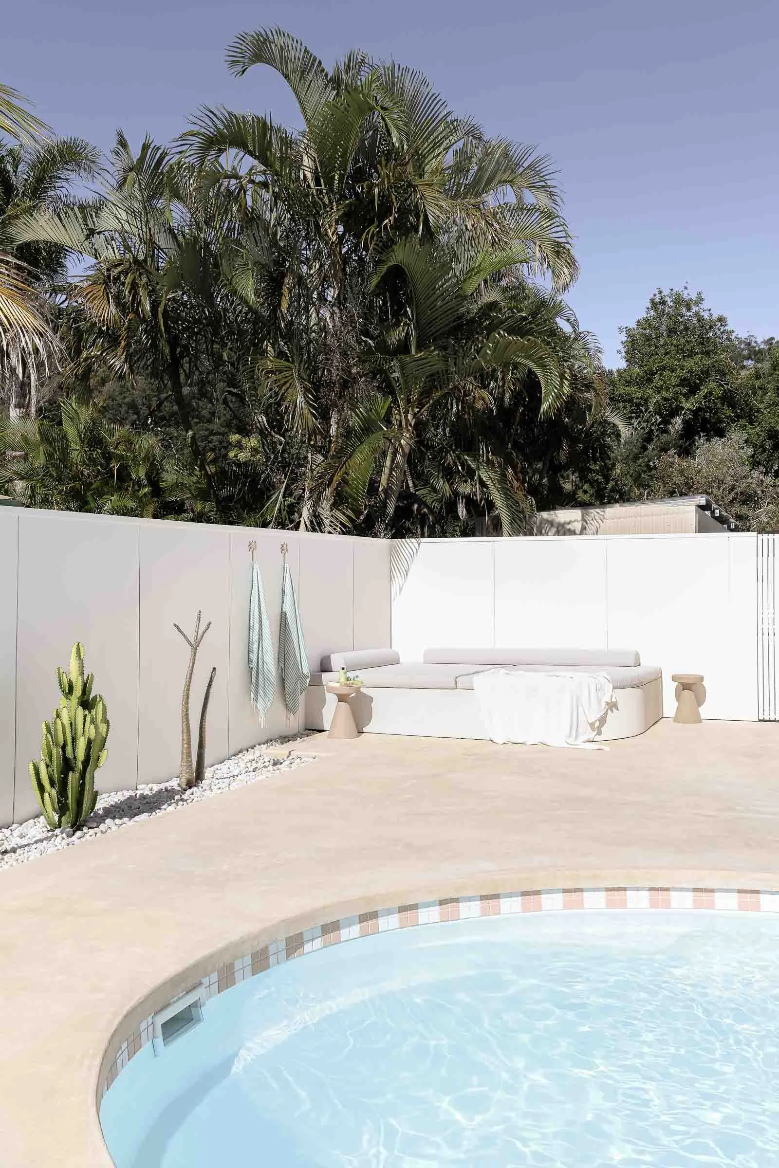 checker tiled oval pool outdoor area