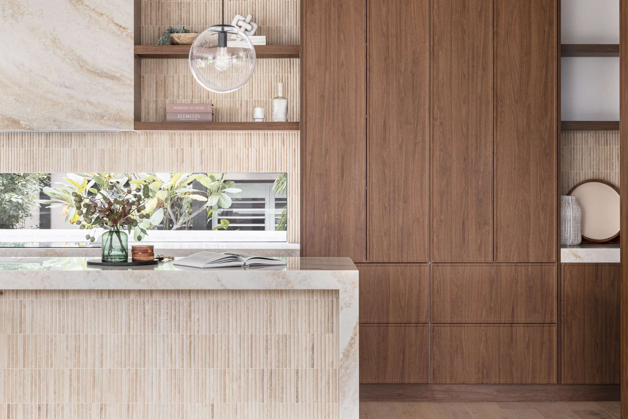 mid-century-modern-walnut-cabinetry-travertine-tiles-kitchen