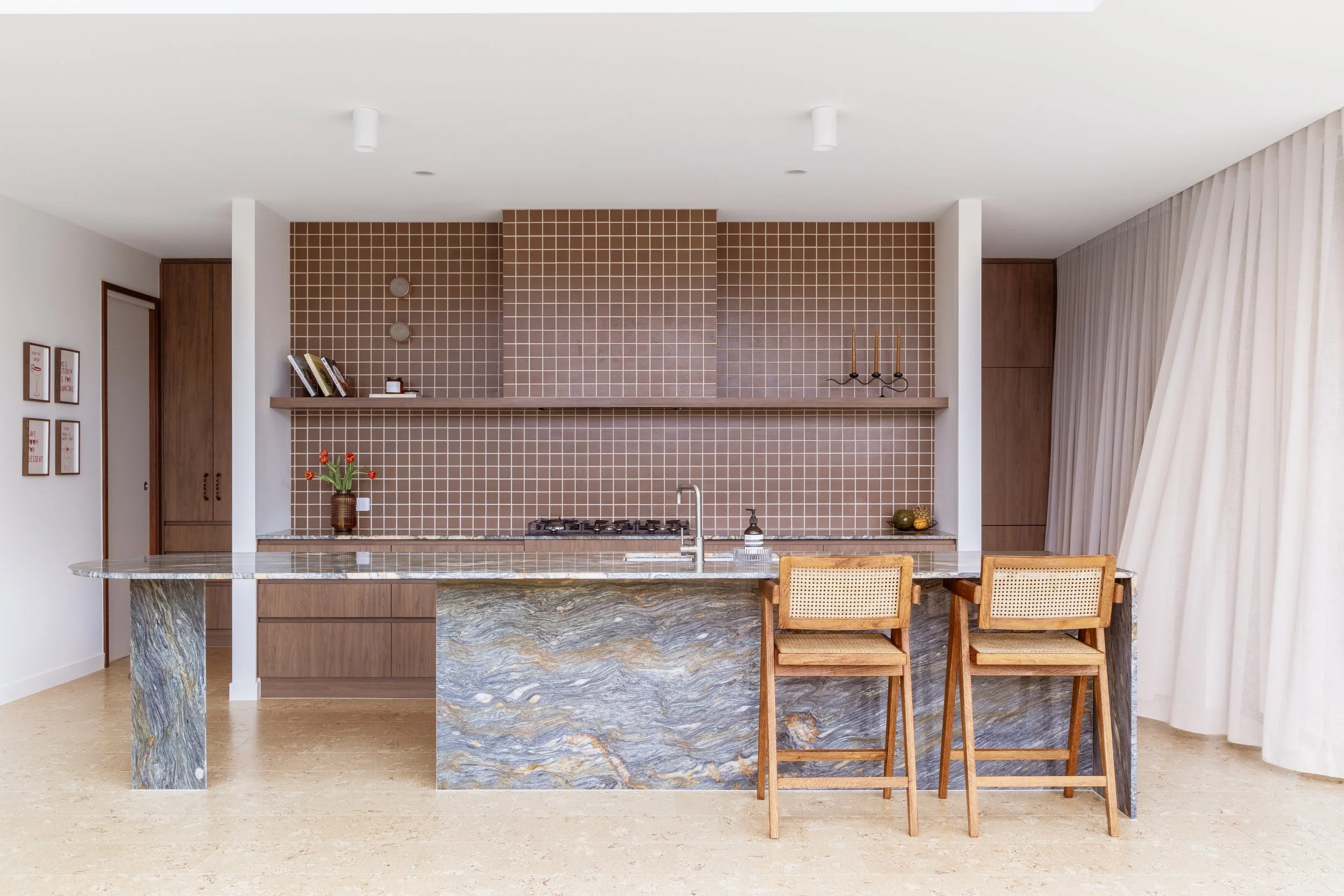 blue marble kitchen island with brown square mosaic tiles