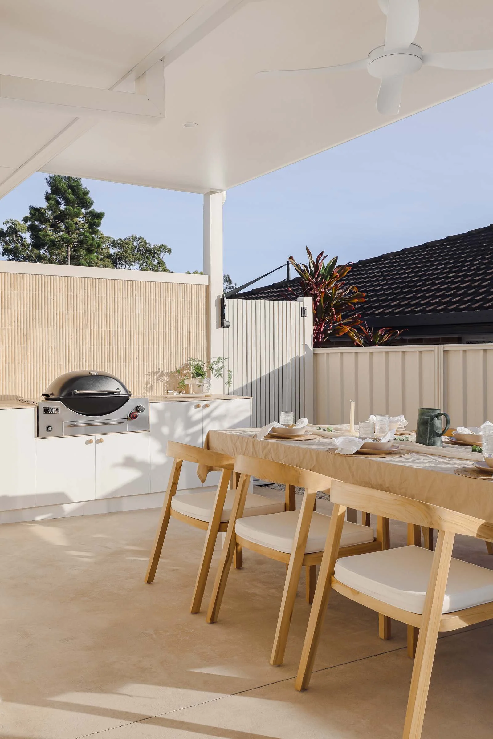 coastal outdoor entertaining area wood dining chairs