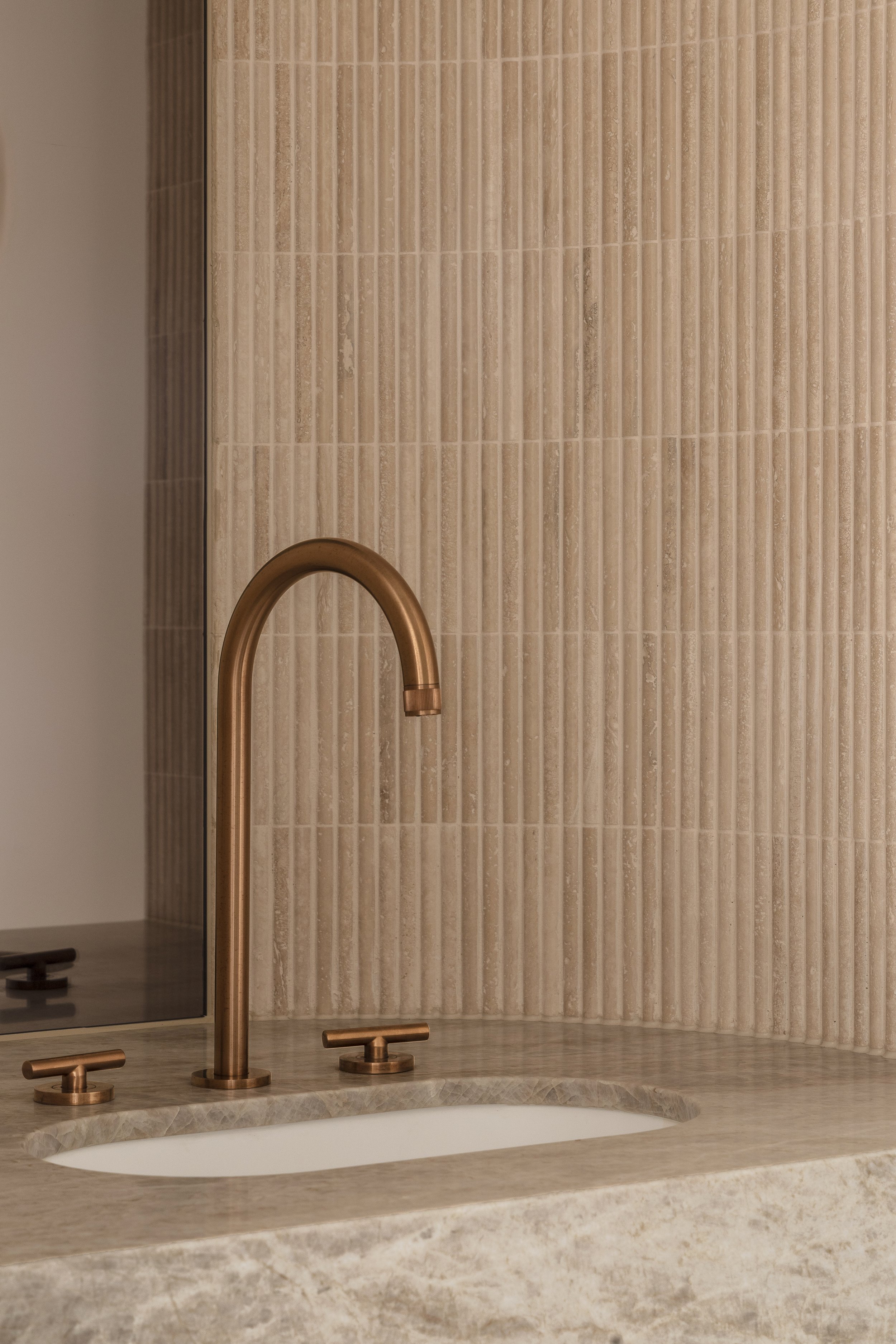 warm-moody-powder-room-brushed-copper-assembly-taps-marble-vanity