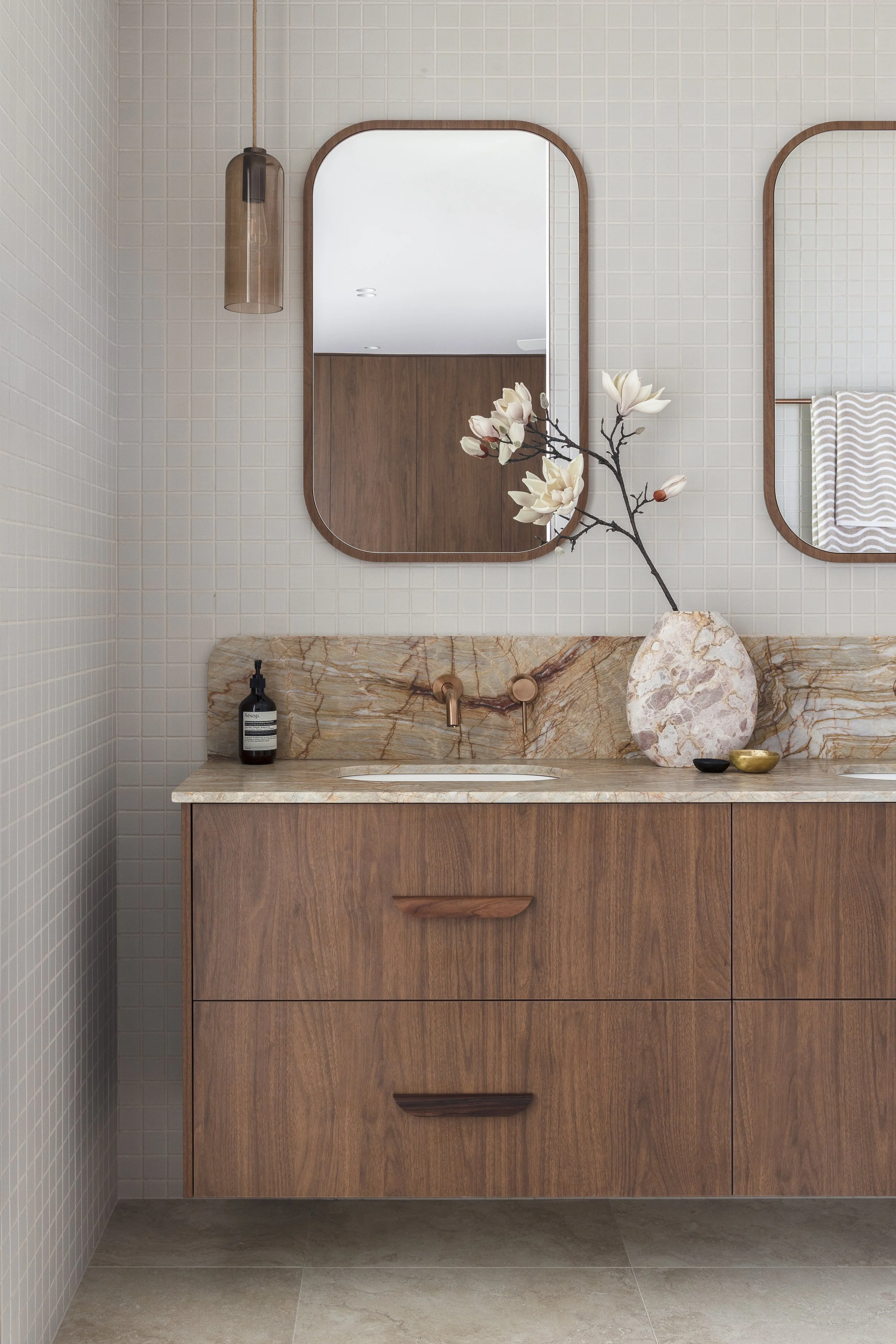 mid century modern bathroom creamy marble and walnut cabinetry vanity