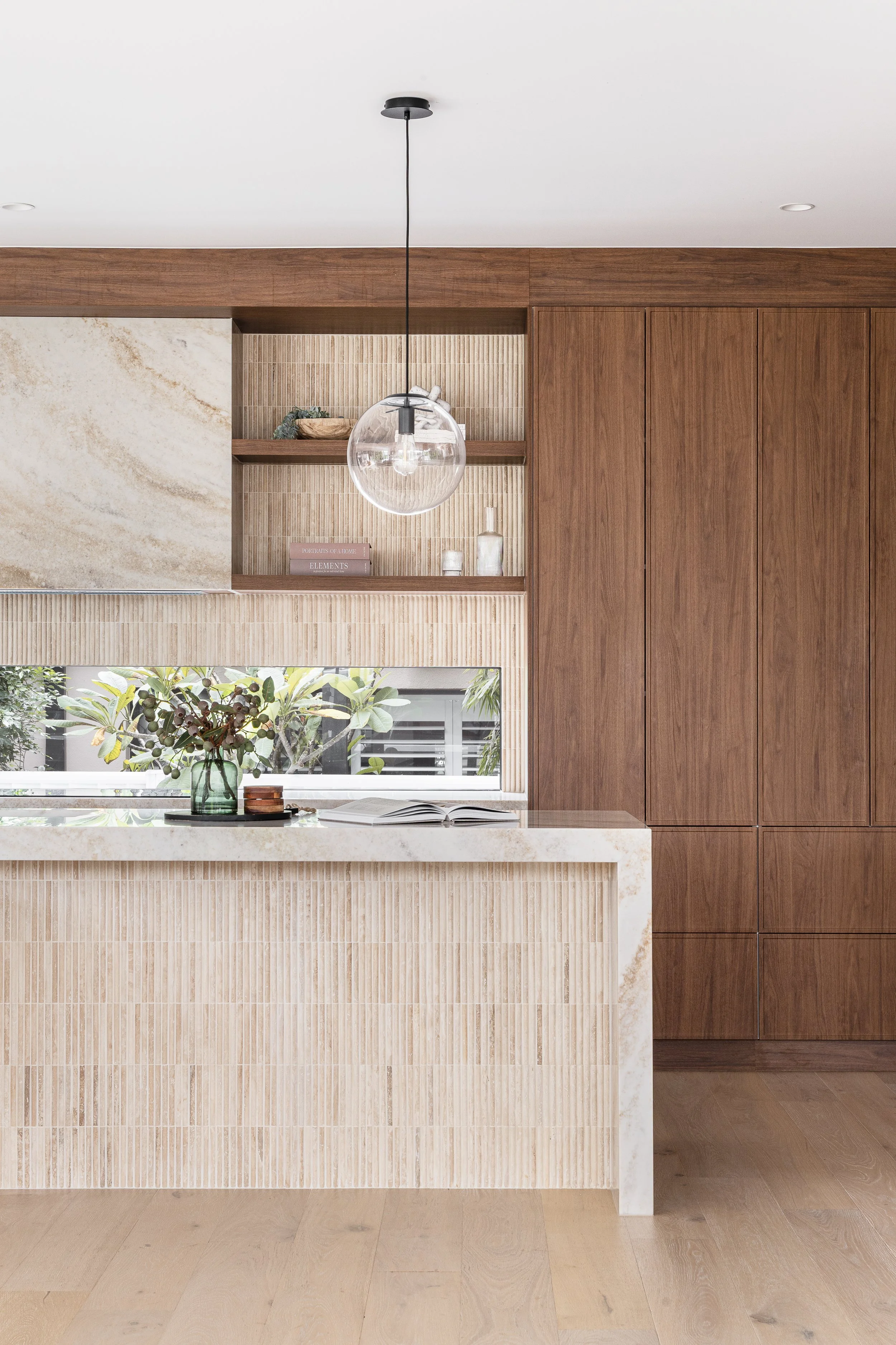 mid-century-modern-walnut-cabinetry-travertine-tiles-kitchen