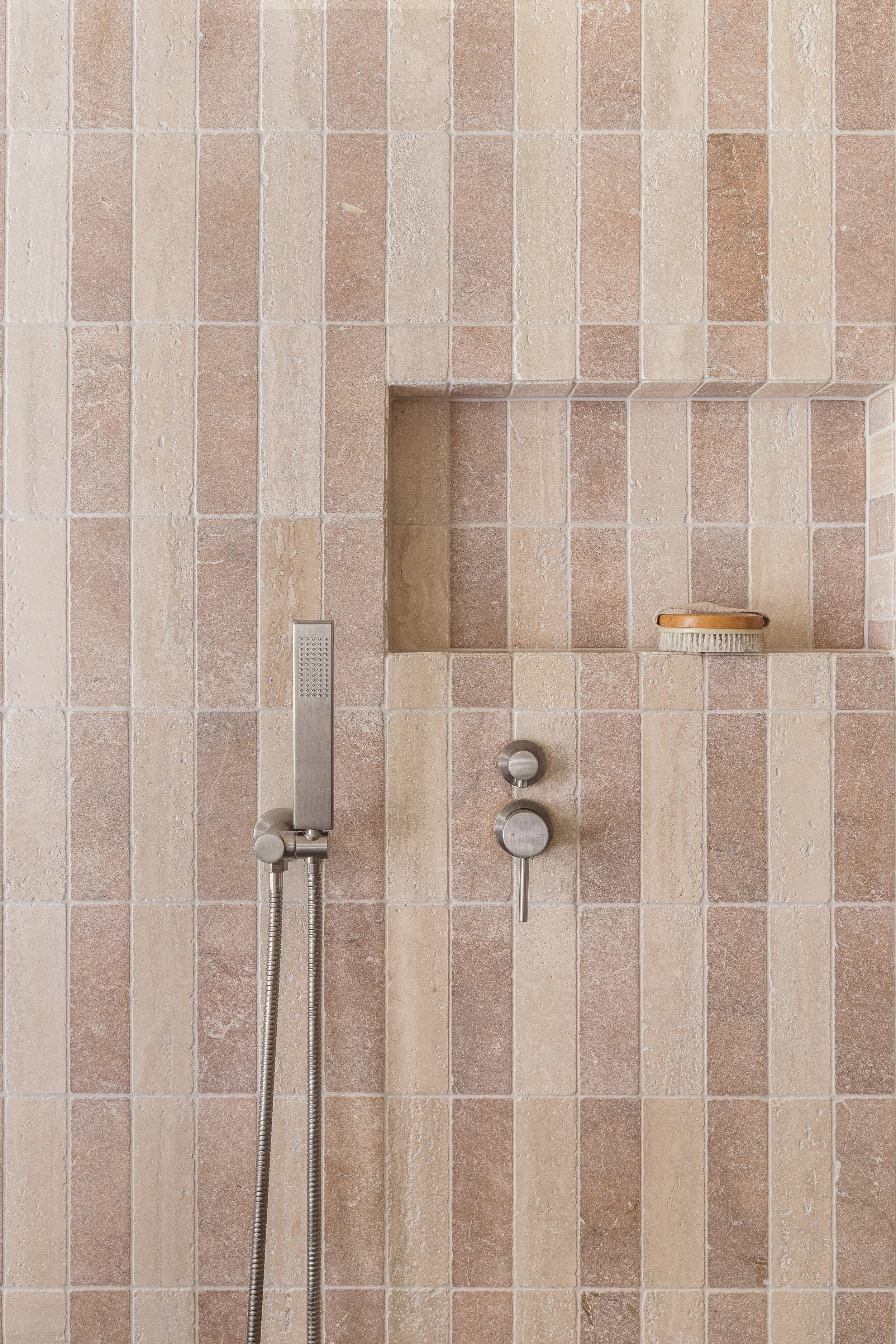 pink and beige checker tile shower bathroom