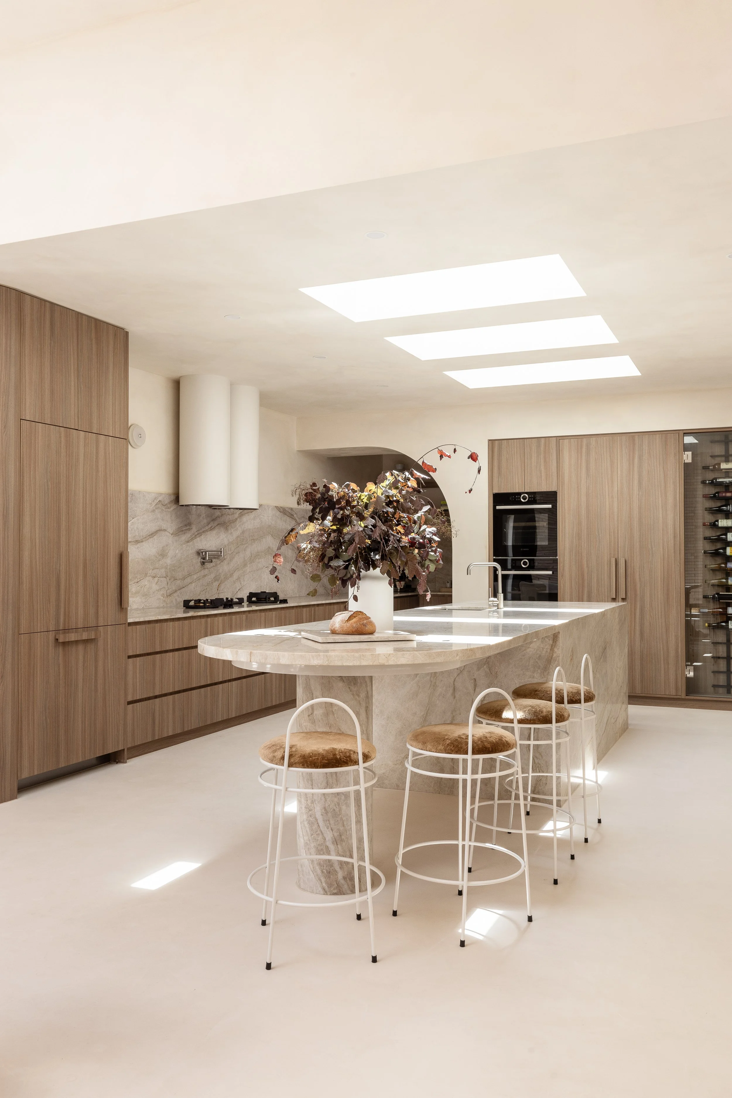 the valle casa mid century modern grey stone kitchen green velvet bar stools