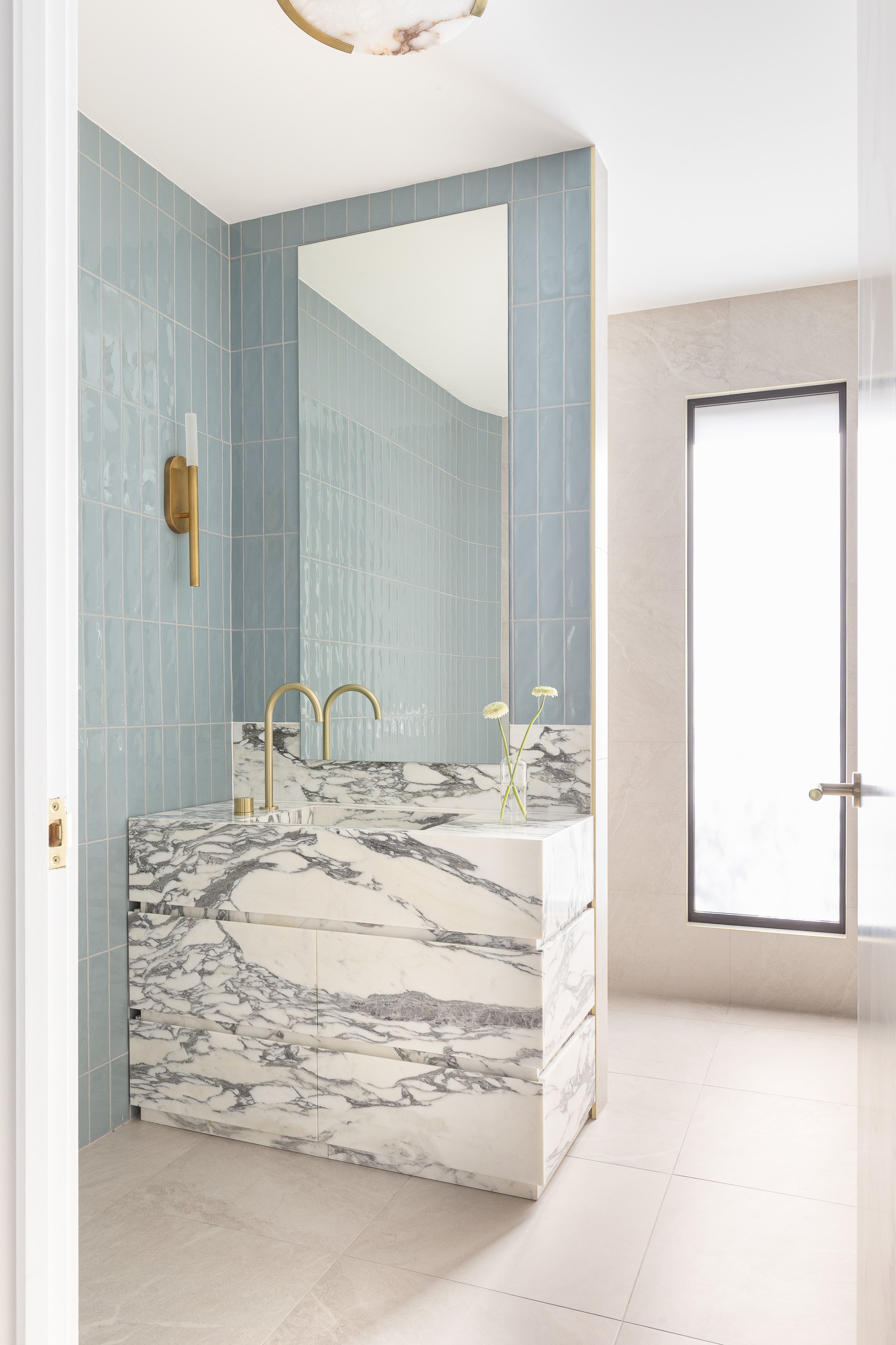blue-hamptons-marble-bathroom-brass-tapware