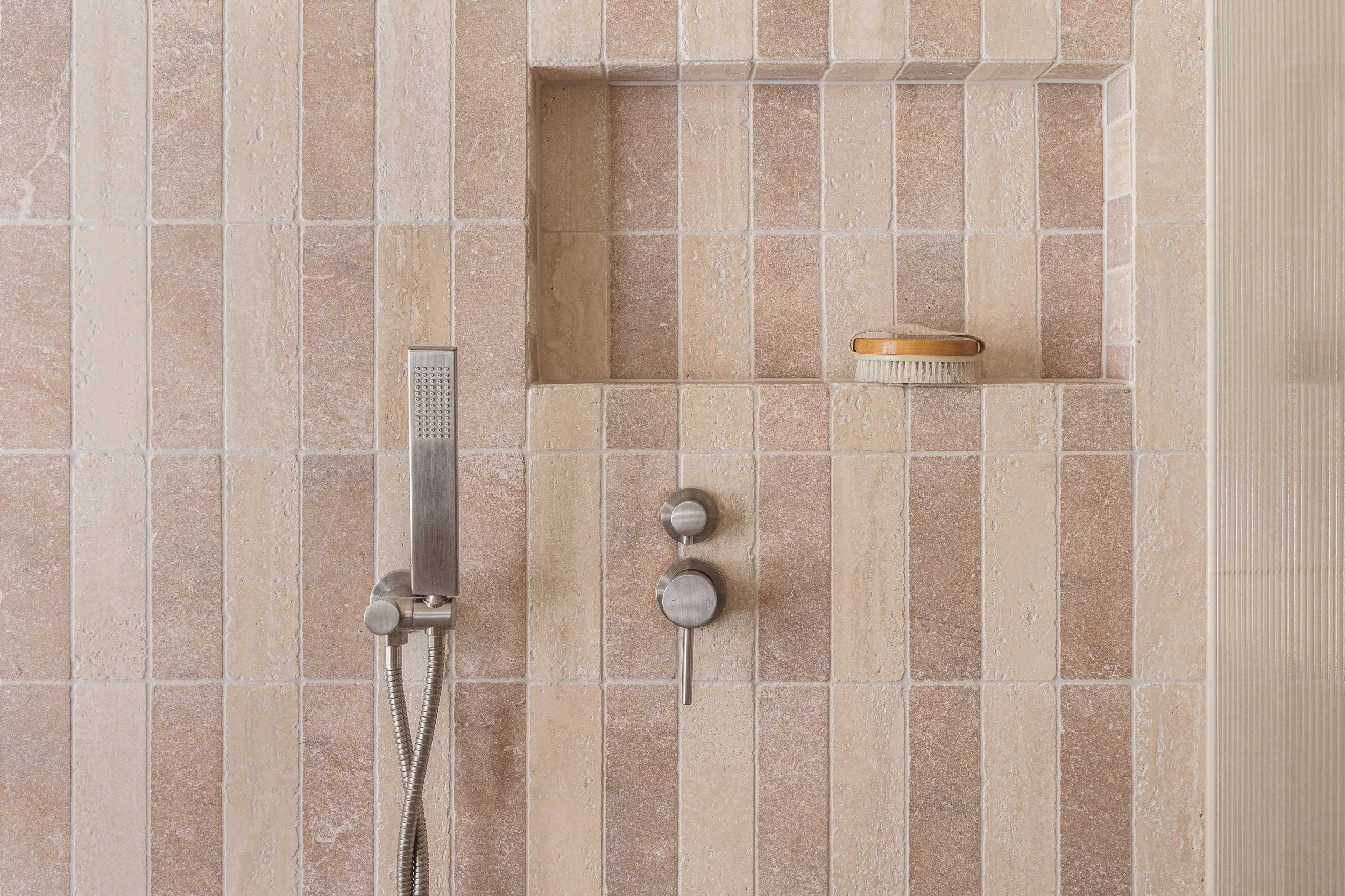 pink and beige checker tile shower bathroom