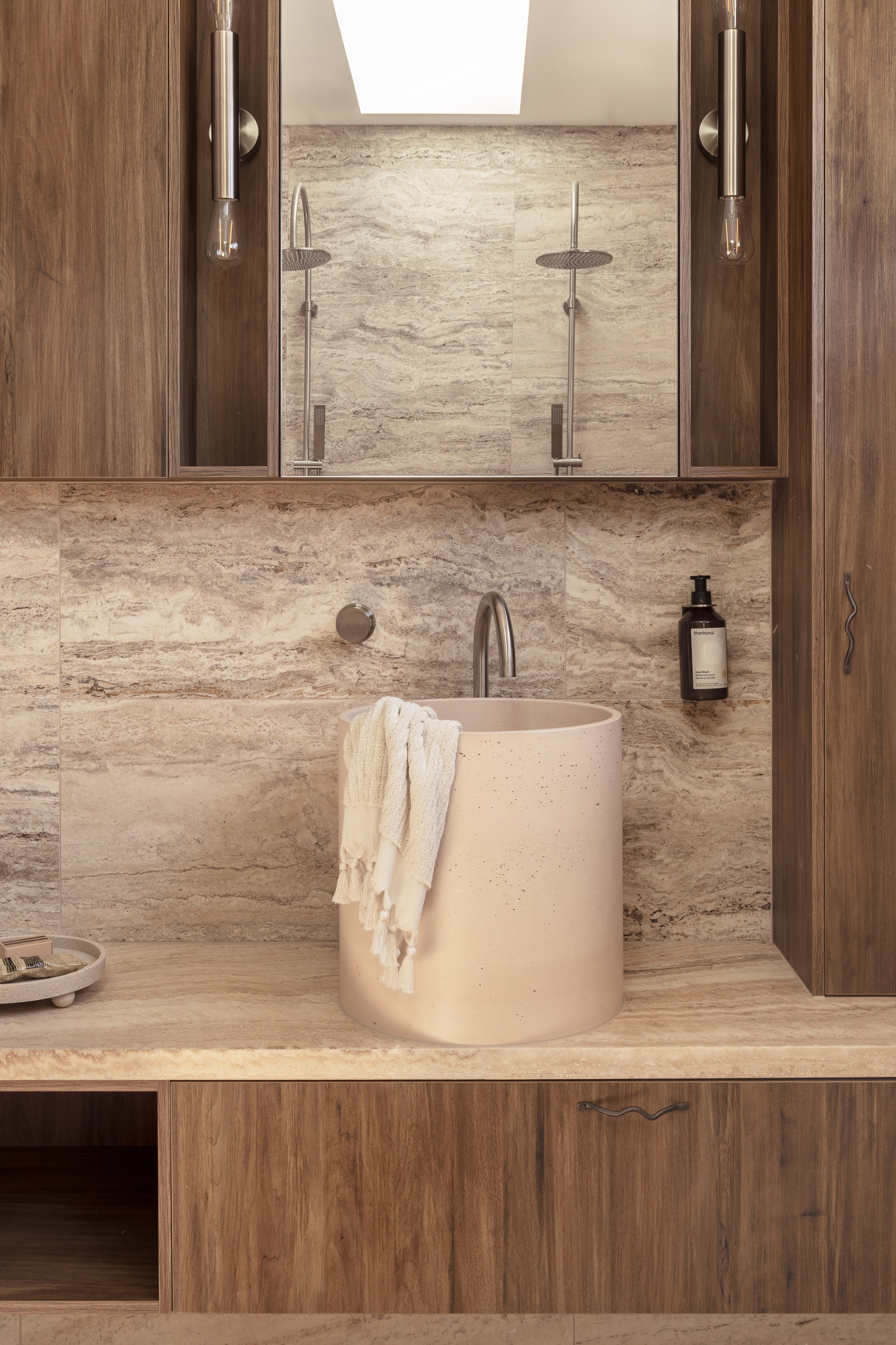 neutral bathroom low bench vanity walnut cabinetry