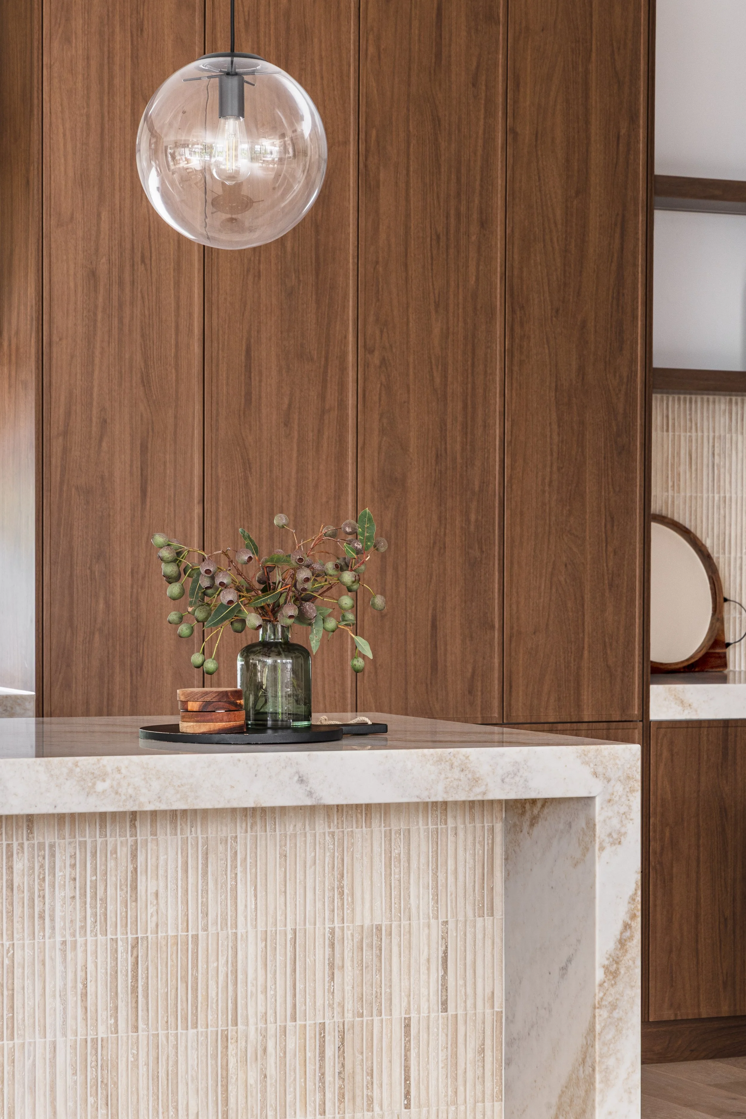 mid-century-modern-walnut-cabinetry-travertine-tiles-kitchen