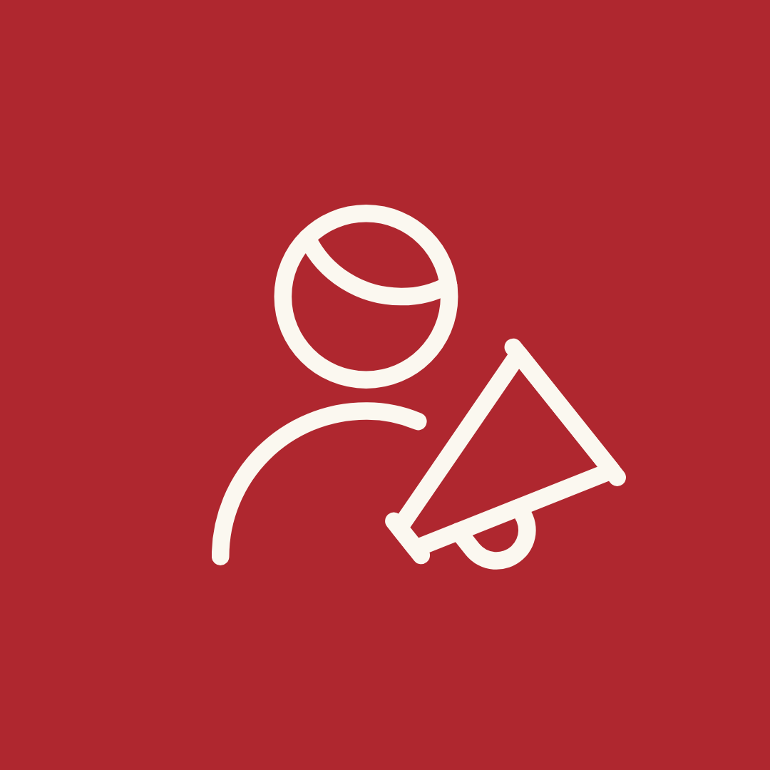 Outline of a shield with four puzzle pieces on a red background.