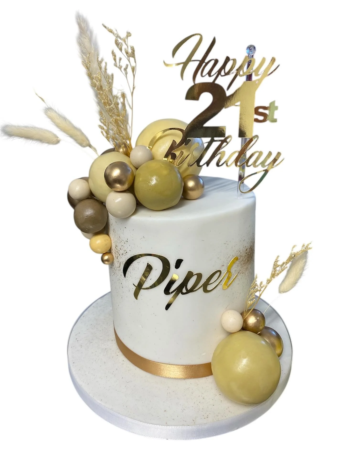 Shades of gold and beige with balls. This cake for piper left the studio on Monday