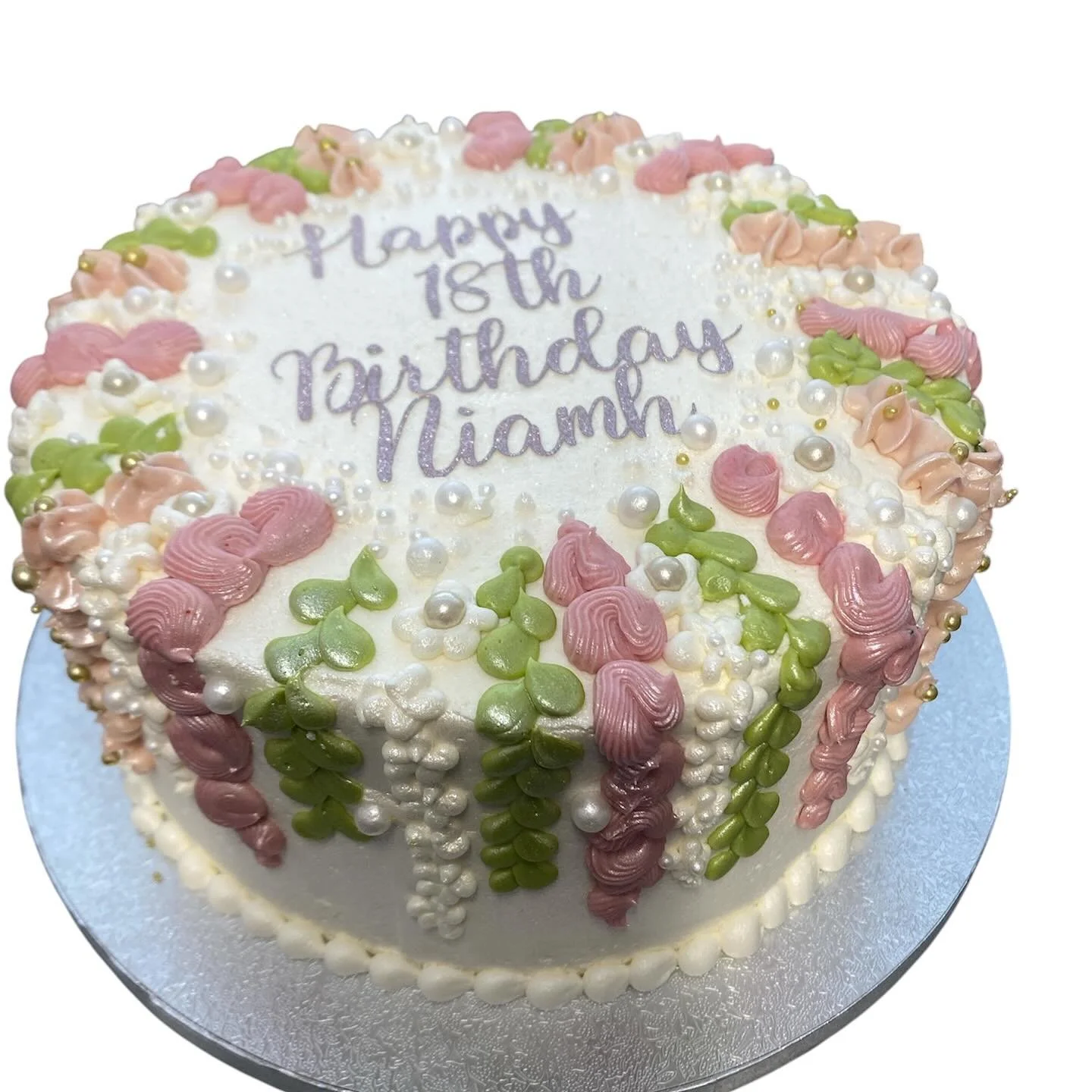 Pretty frosted cake. I used Swiss meringue frosting for the flower detailing.  That was a first for me. #swissmeringue