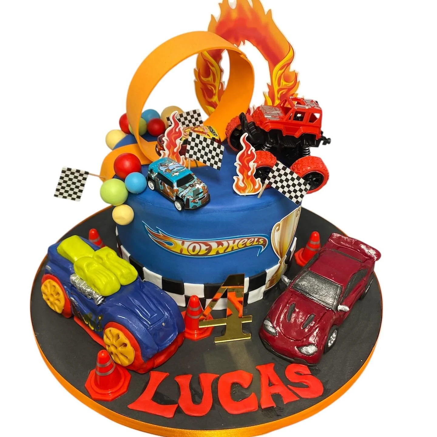 Hot wheels cake complete with Rice Krispie cars on the board.  #hotwheelscake