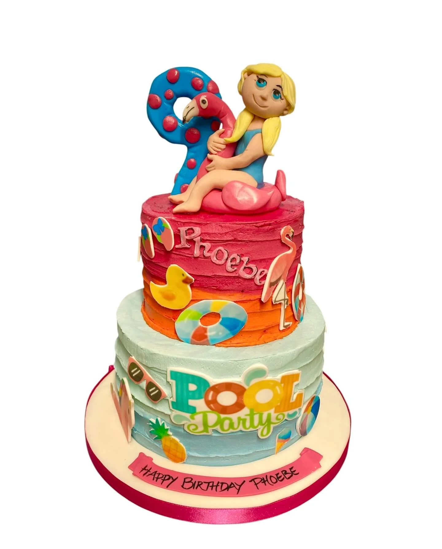 A pool party themed cake and matching cupcakes for Phoebe.