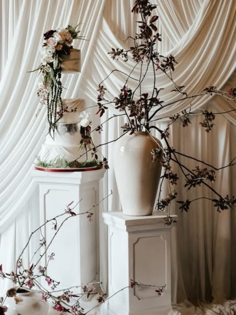 Knowle Hall. 
Created for a wedding promotional shoot at a brand new wedding venue. This cake takes inspiration from the theme of luxury trailing flora and white swag drapes. 