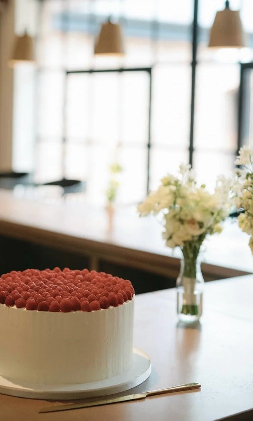 Raspberry and Vanilla frosted cake. 

Vanilla sponge cake with a strawberry conserve and vanilla cream with raspberries covering the top.  Delivered to Grace and Savour at    Hampton Manor for a small intimate wedding . 